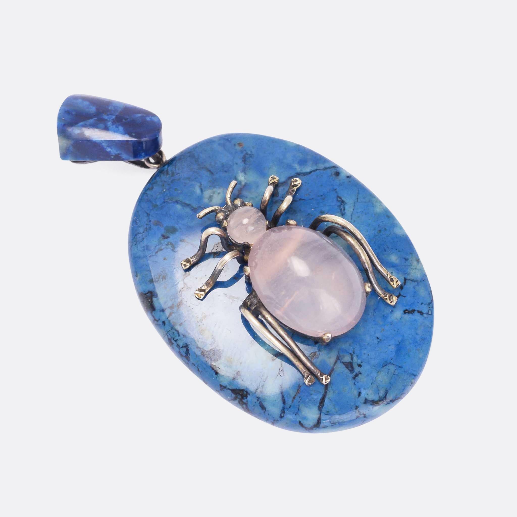 A beautiful antique bug pendant dating from the late Victorian era. The bug itself is set with rose quartz and has silver legs and antennae, and is rests on an oval lozenge of Swiss lapis - complete with matched bail. It's a good big size and