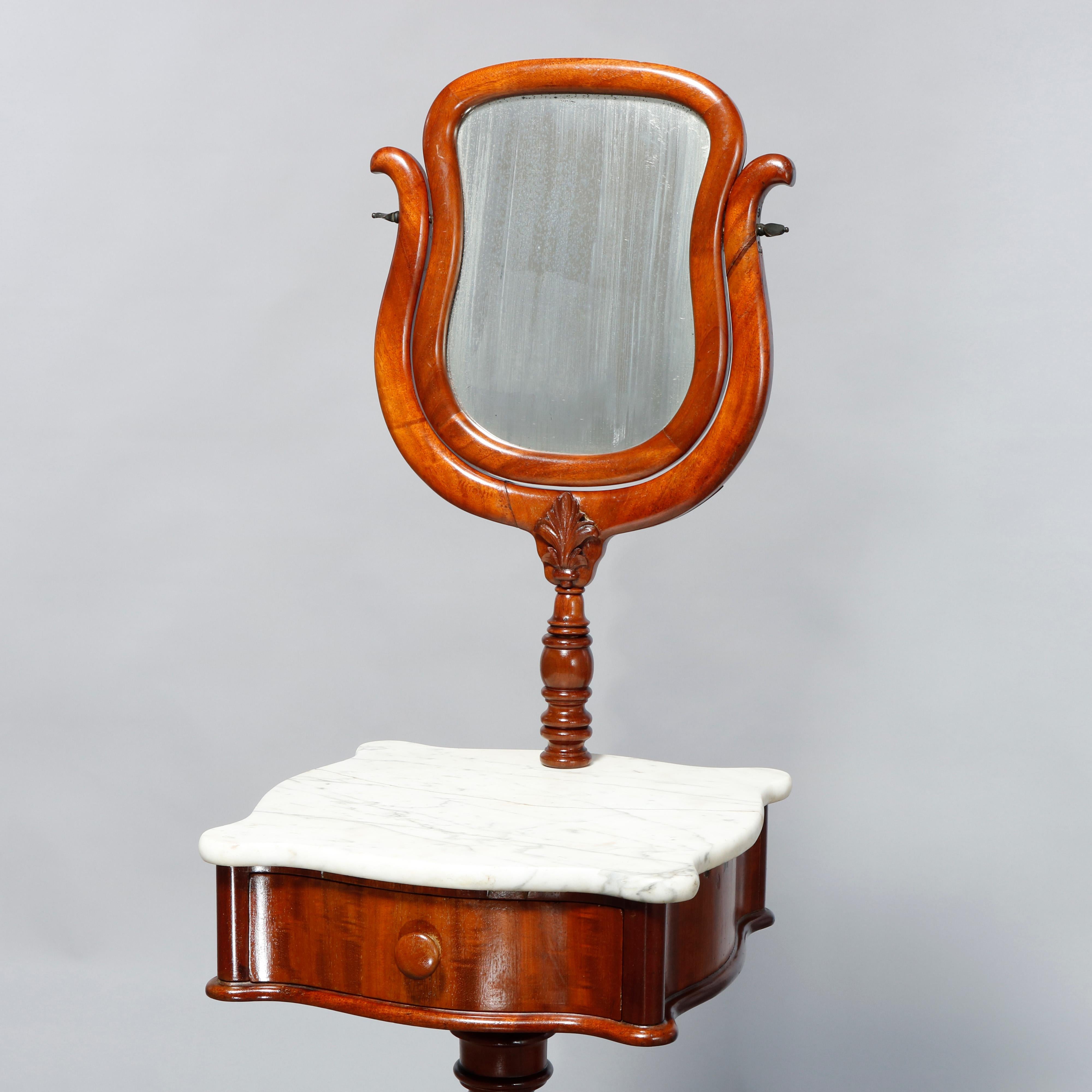 An antique Victorian shaving mirror stand offers rosewood construction with shield single drawer serpentine case having shaped marble top raised on carved twist column with scroll form legs, c1880

Measures: 60.75