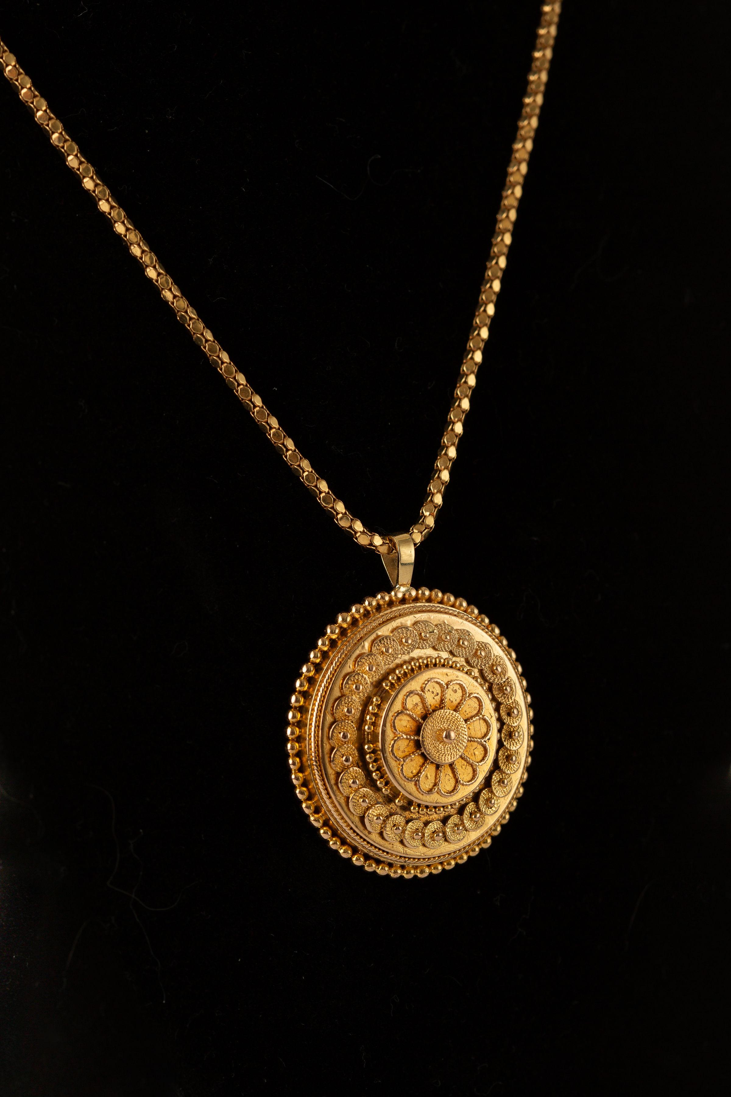Material: 14k Pendant; Chain 18k Yellow Gold with 14k clasp
Weight: 13.7 grams 
Length: 18  3/8 inches
Pendant dimensions: 36.4 mm x 30.2 mm

14k yellow gold Victorian pendant on 18k yellow gold chain. The chain has a 14k yellow gold clasp. The