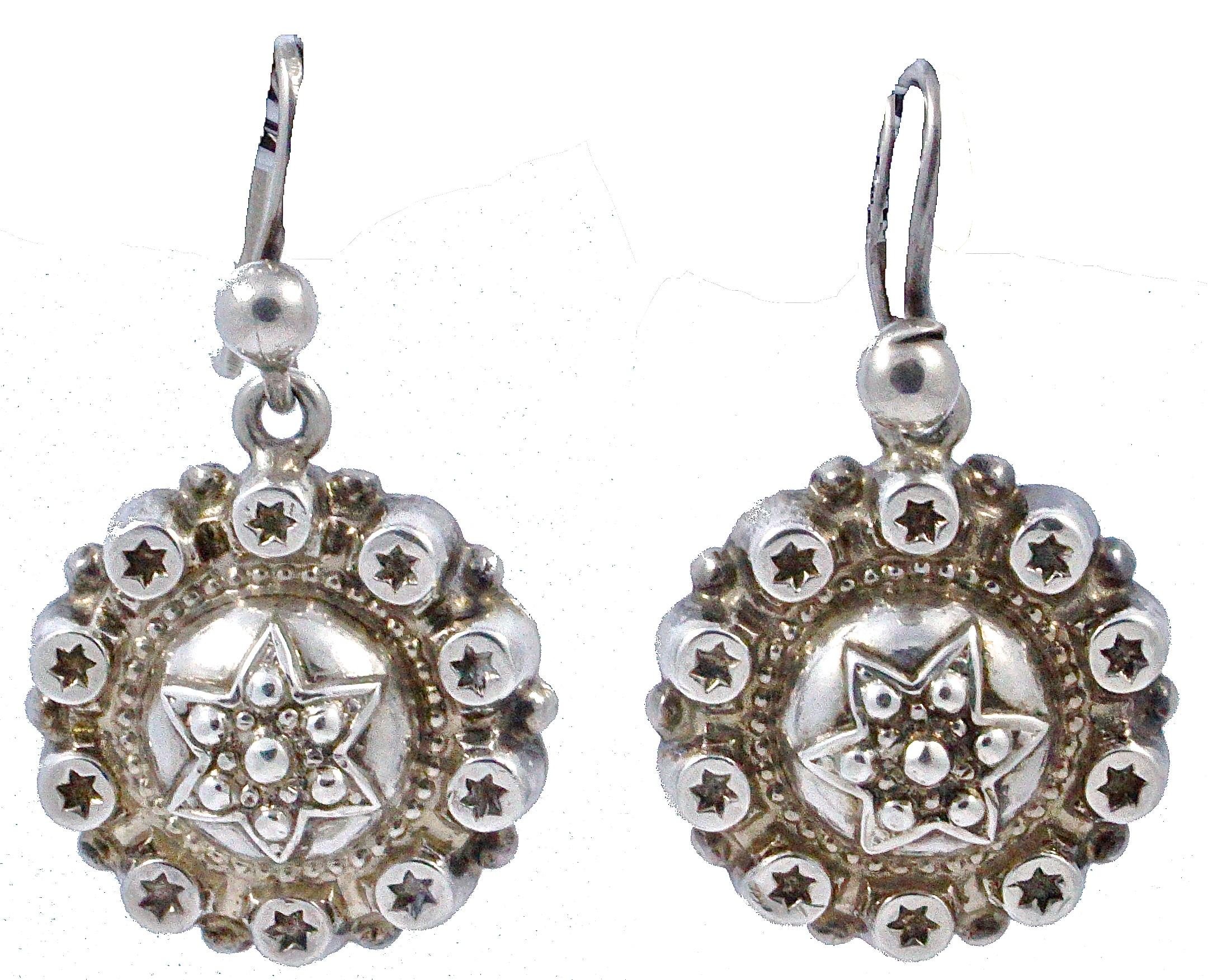 Beautiful antique round silver drop earrings, featuring a detailed domed centre star with a star edging, and gilt finish. Measuring diameter 1.5cm / .59 inches, they are unmarked but test for silver. The earrings are in very good condition, there is