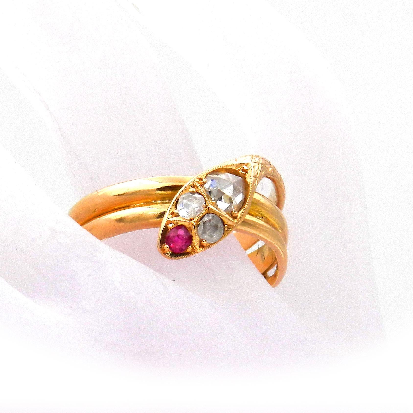 Antique Victorian Ruby and Diamond 18K Gold Snake Ring circa 1880

A decorative snake ring from around 1880, made of 18K/750 yellow gold, elegantly twisted, the head finely chiseled and set with an oval rose diamond, the eyes are two small rose