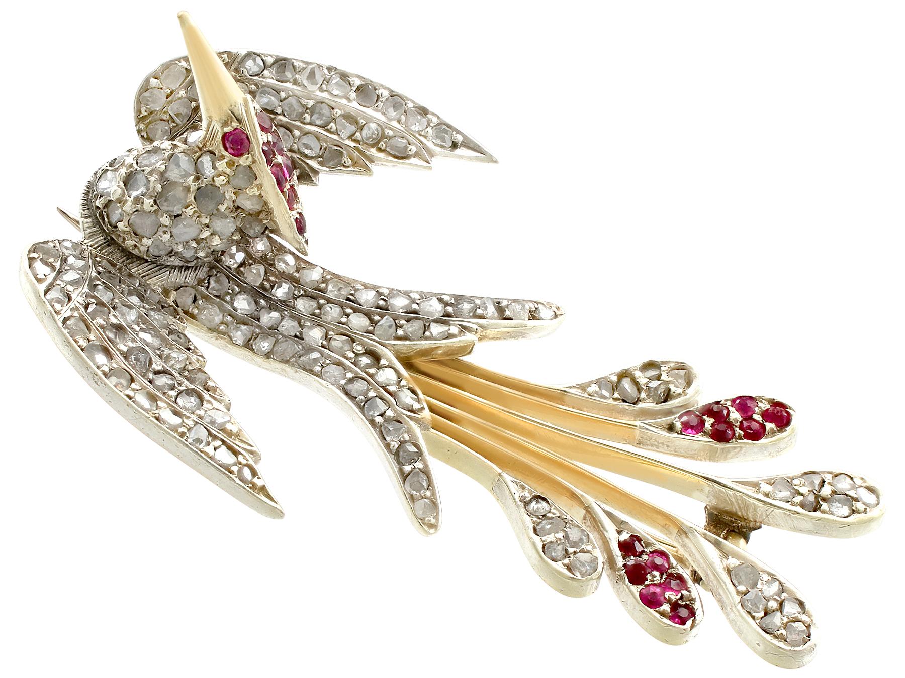 An impressive Victorian 0.23 carat ruby and 0.70 carat diamond, 10 karat yellow gold and silver set bird brooch; part of our diverse antique jewelry and estate jewelry collections.

This fine and impressive antique diamond brooch has been crafted in