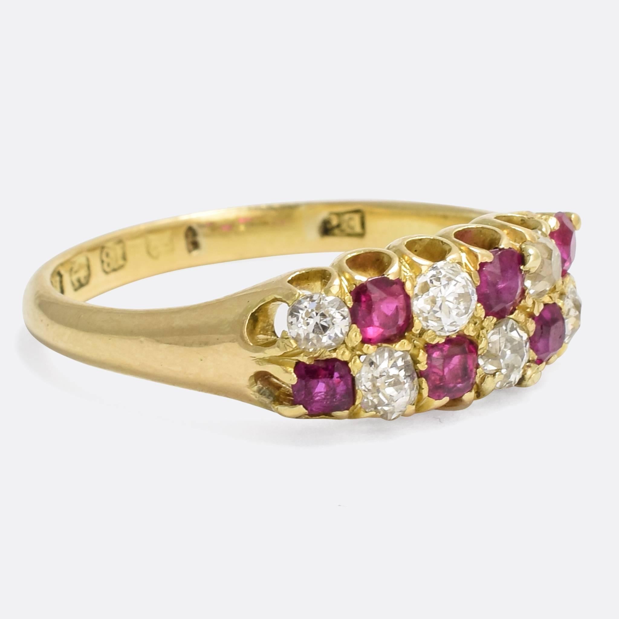 A cool antique chequerboard ring set with two rows of alternating rubies and old cut diamonds. The stones rest in simple scalloped claws, and are all clean and bright. The piece is modelled in 18 karat gold, with clear English hallmarks that date it