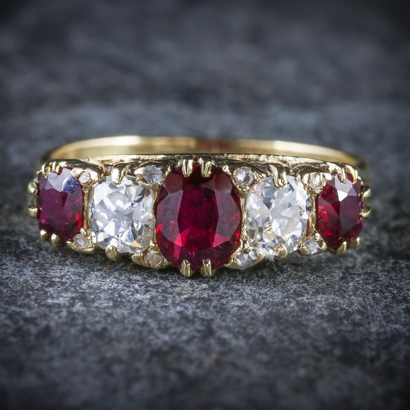 This breathtaking antique Ruby and Diamond ring is Victorian, Circa 1900

The ring is adorned with a trilogy of pigeon blood Rubies with two sparkling old cut Diamonds in-between

The central Ruby is 0.65ct, the outer are 0.45ct with 1ct of Diamond