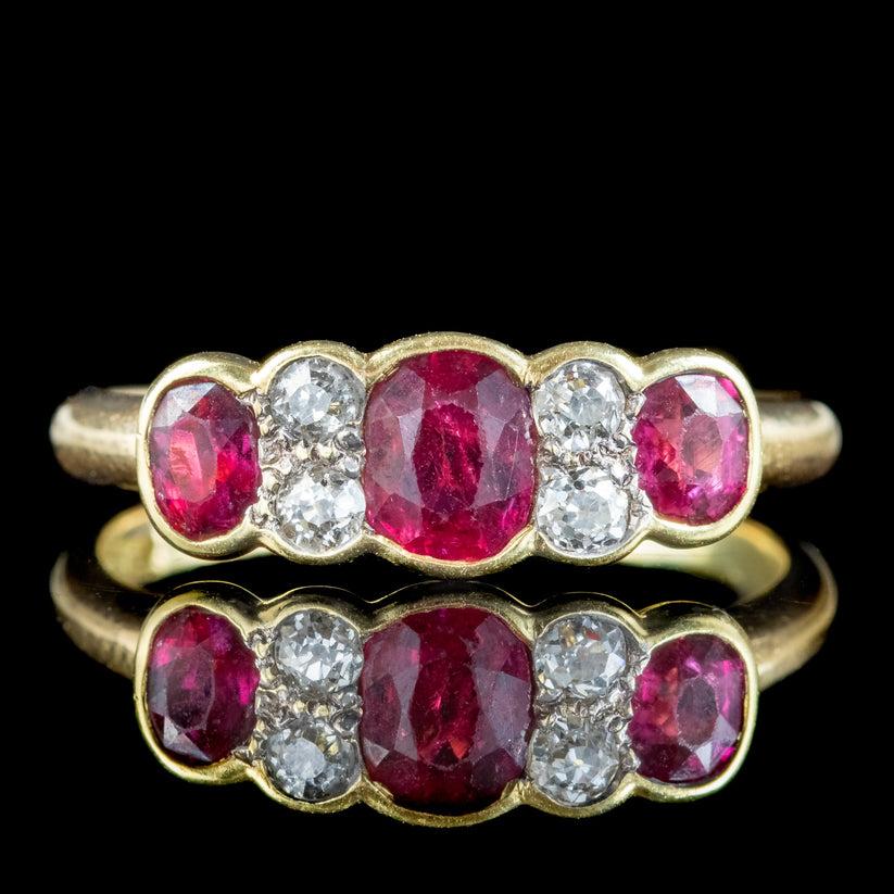 A gorgeous antique Victorian ring bezel set with a trilogy of deep, cherry-pink rubies weighing approx. 0.45ct in the centre and 0.20ct on either side (0.80ct total). They’re accompanied by four twinkling old mine cut diamonds nestled in between,