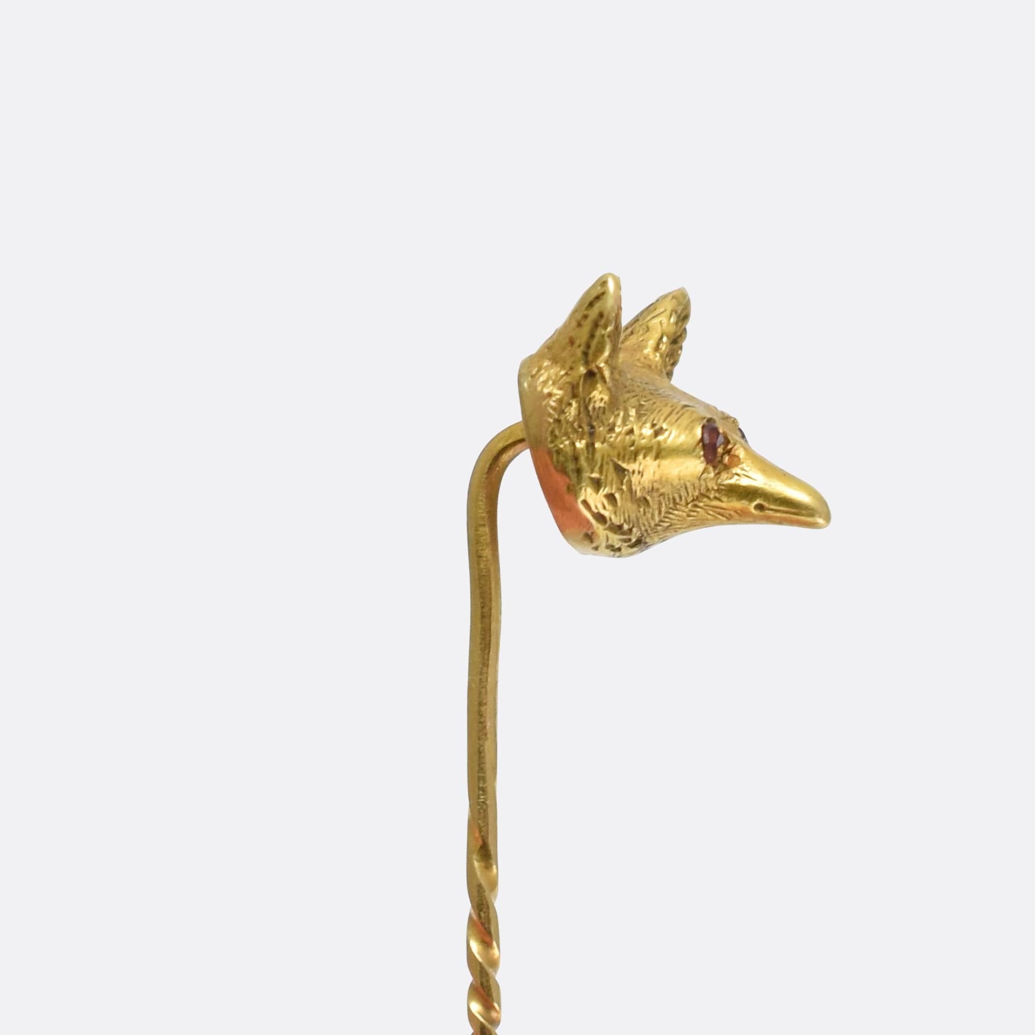 A cute antique fox pin dating from the late Victorian era. The head is beautifully textured, and the eyes set with faceted rubies. Modelled in 15 karat gold throughout, the fox has a sweet, almost cartoon-like face with a long snout.

STONES
Ruby