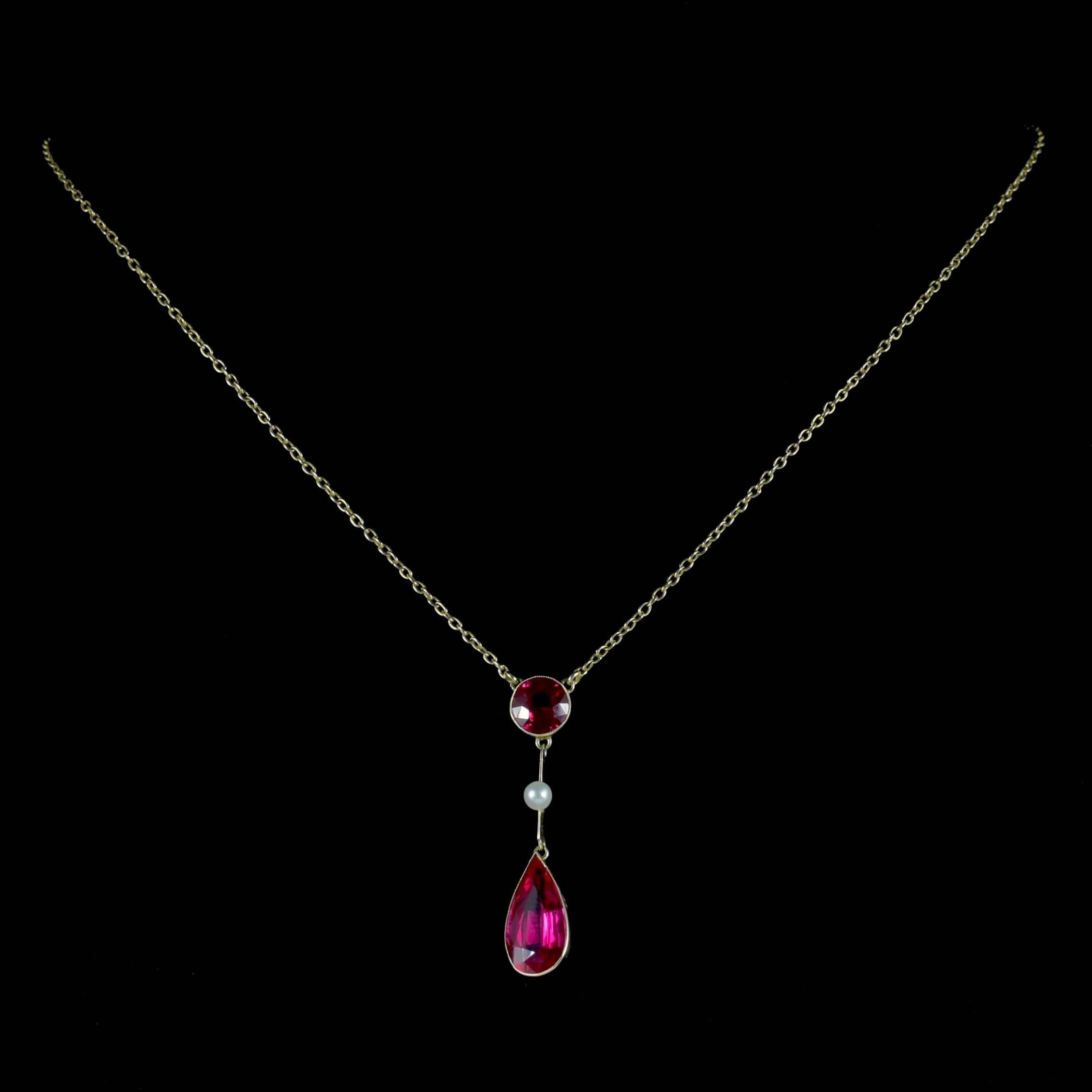 This beautiful antique Ruby and Pearl lavaliere necklace is Victorian Circa 1890. 

The fabulous drop pendant displays a round 1.50ct Ruby at the top leading down to a lovely Pearl and a larger 4ct Ruby in the shape of a teardrop.

Ruby is