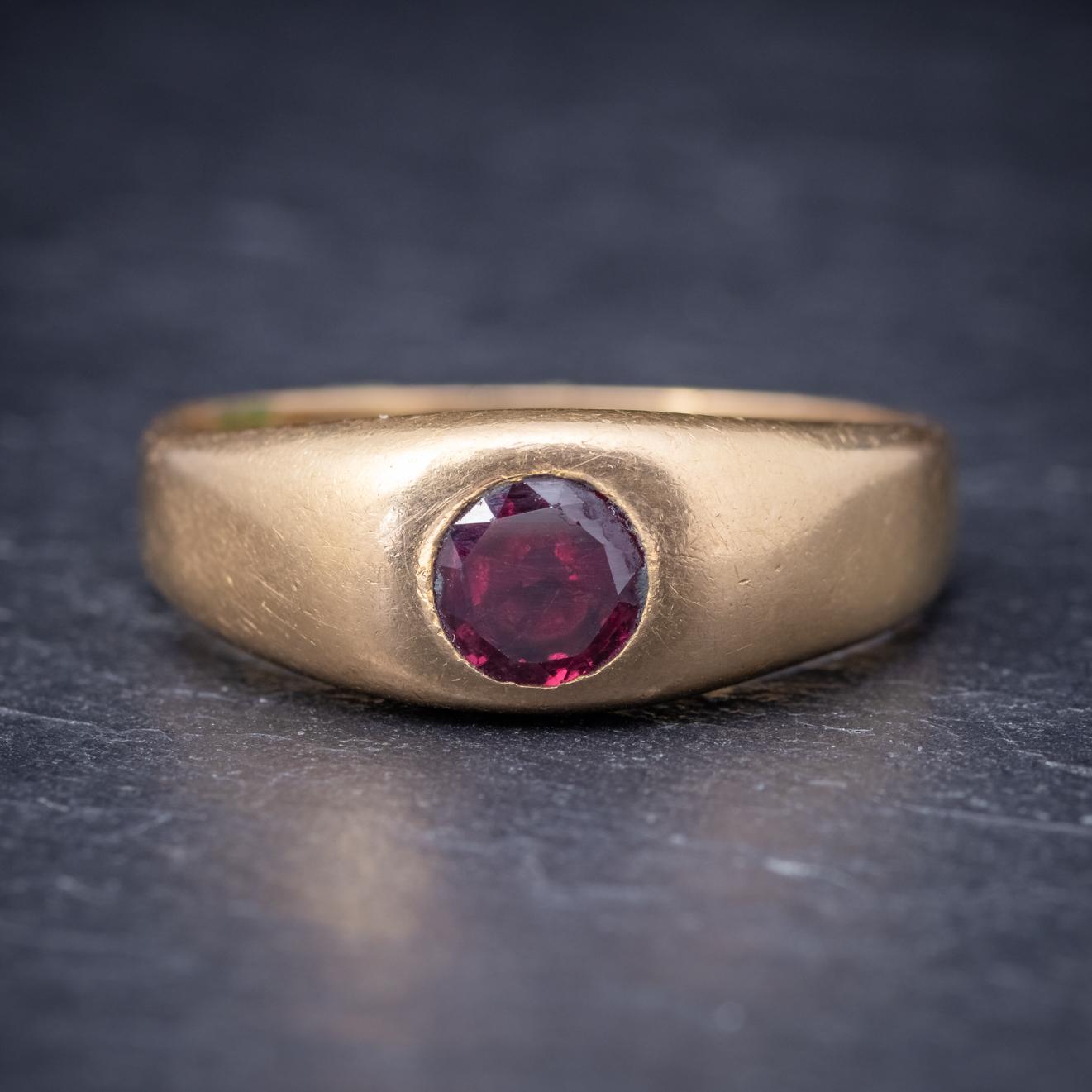 A grand antique Victorian ring set with a deep red Ruby in the centre which is 0.60ct. The ring is a lovely weight and modelled in solid 18ct Yellow Gold complimenting the Ruby beautifully. This would suit either sex and has a lovely minimalist