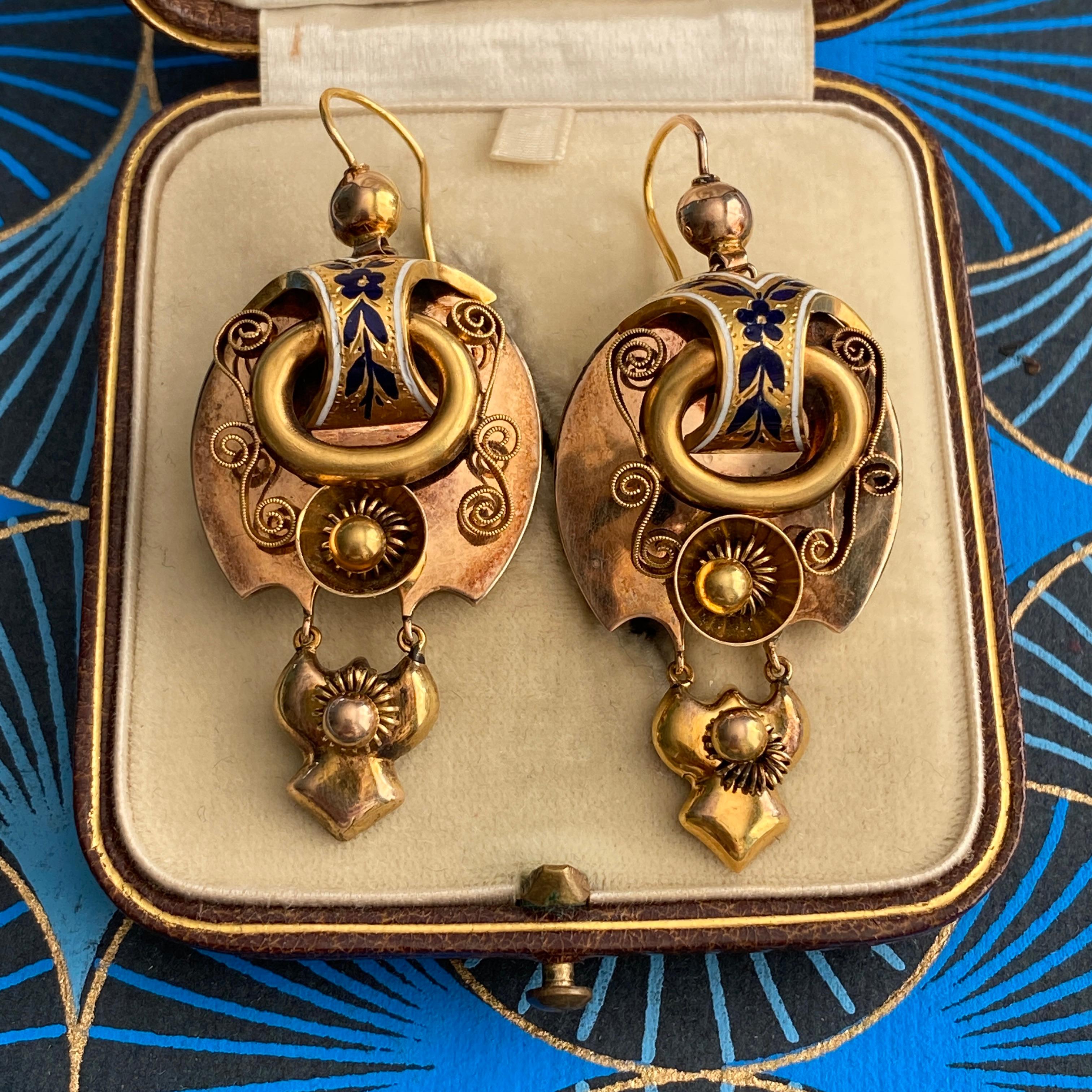 Details:
Fabulous pair of Antique Victorian 14K Gold Enamel Repousse Earrings from circa 1850-1860. These are truly stunning in person, with the glamour and style befitting a Victorian woman to wear to a formal ball, or a dinner party. They are 14K