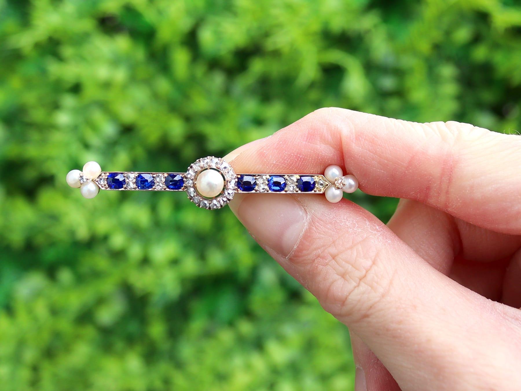 A stunning antique Victorian 0.95 carat sapphire and seed pearl, 0.82 carat diamond and 14 karat yellow gold bar brooch; part of our diverse antique jewelry collections.

This stunning, fine and impressive sapphire bar brooch has been crafted in 14k