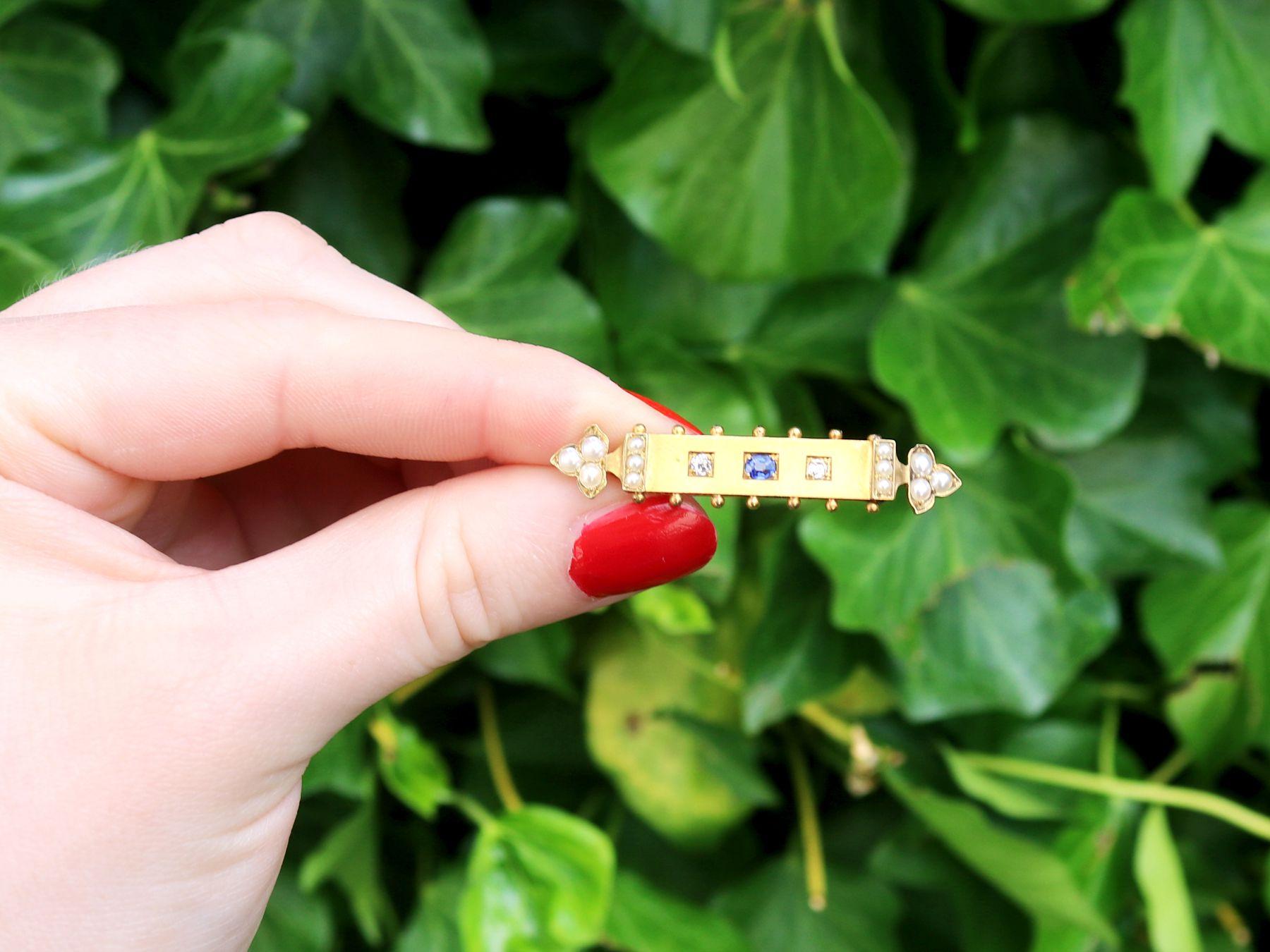A fine and impressive antique Victorian 0.18 carat sapphire and seed pearl, 0.08 carat diamond and 18 karat yellow gold bar brooch; part of our diverse antique jewelry collections.

This fine and impressive antique Victorian brooch has been crafted