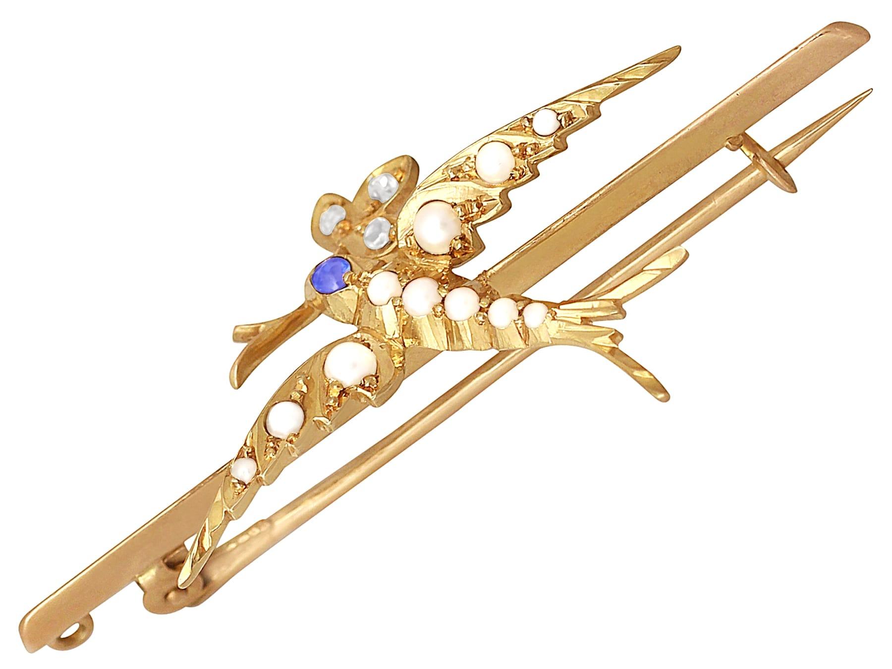 Round Cut Antique Victorian Sapphire Diamond and Seed Pearl Yellow Gold Swallow Brooch