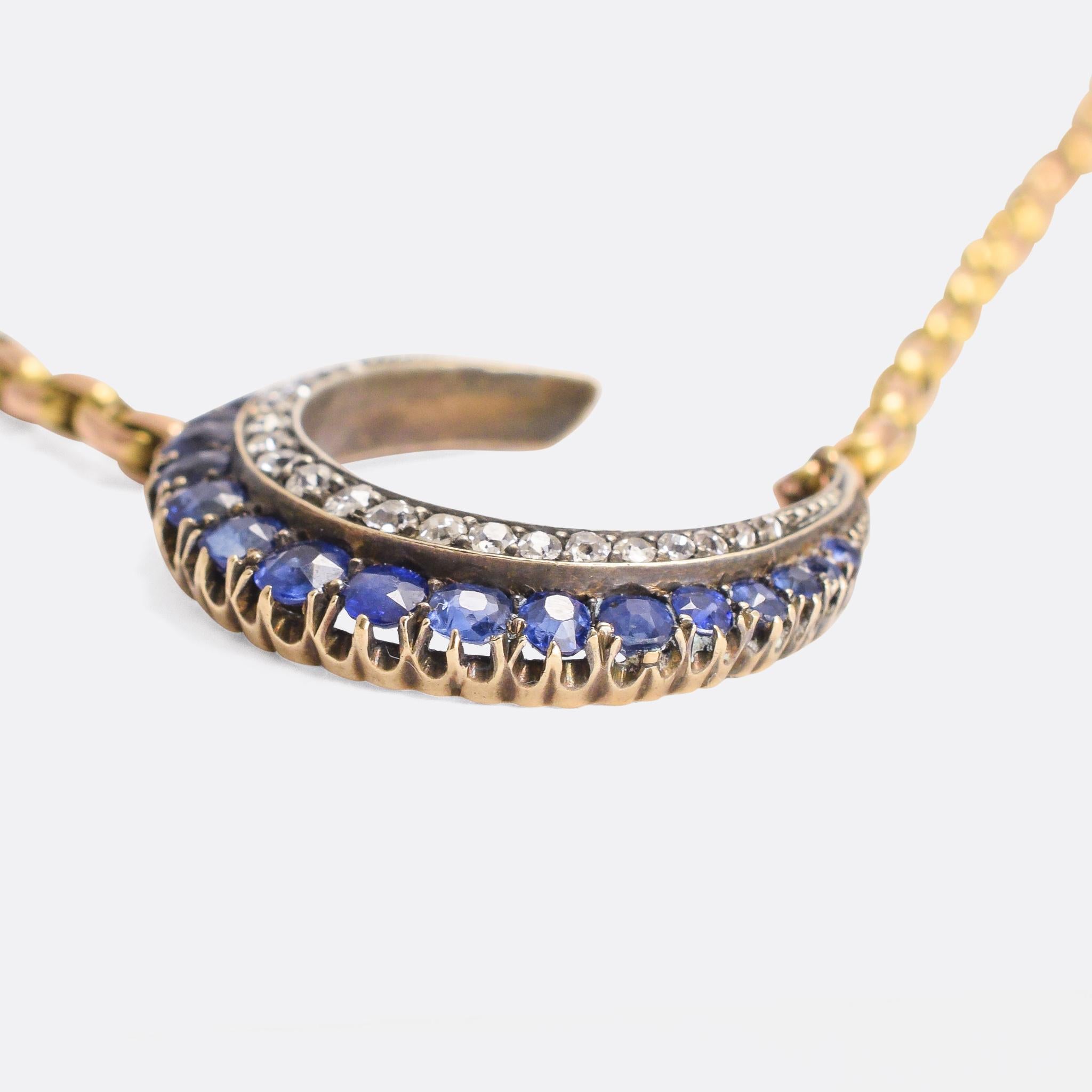 A striking antique Crescent Moon necklace. The pendant is set with blue sapphires and old cut diamonds, and dates from circa 1900; we've mounted it on a heavy 9k gold Victorian chain with tag fastener. A particularly cool example of the Victorian