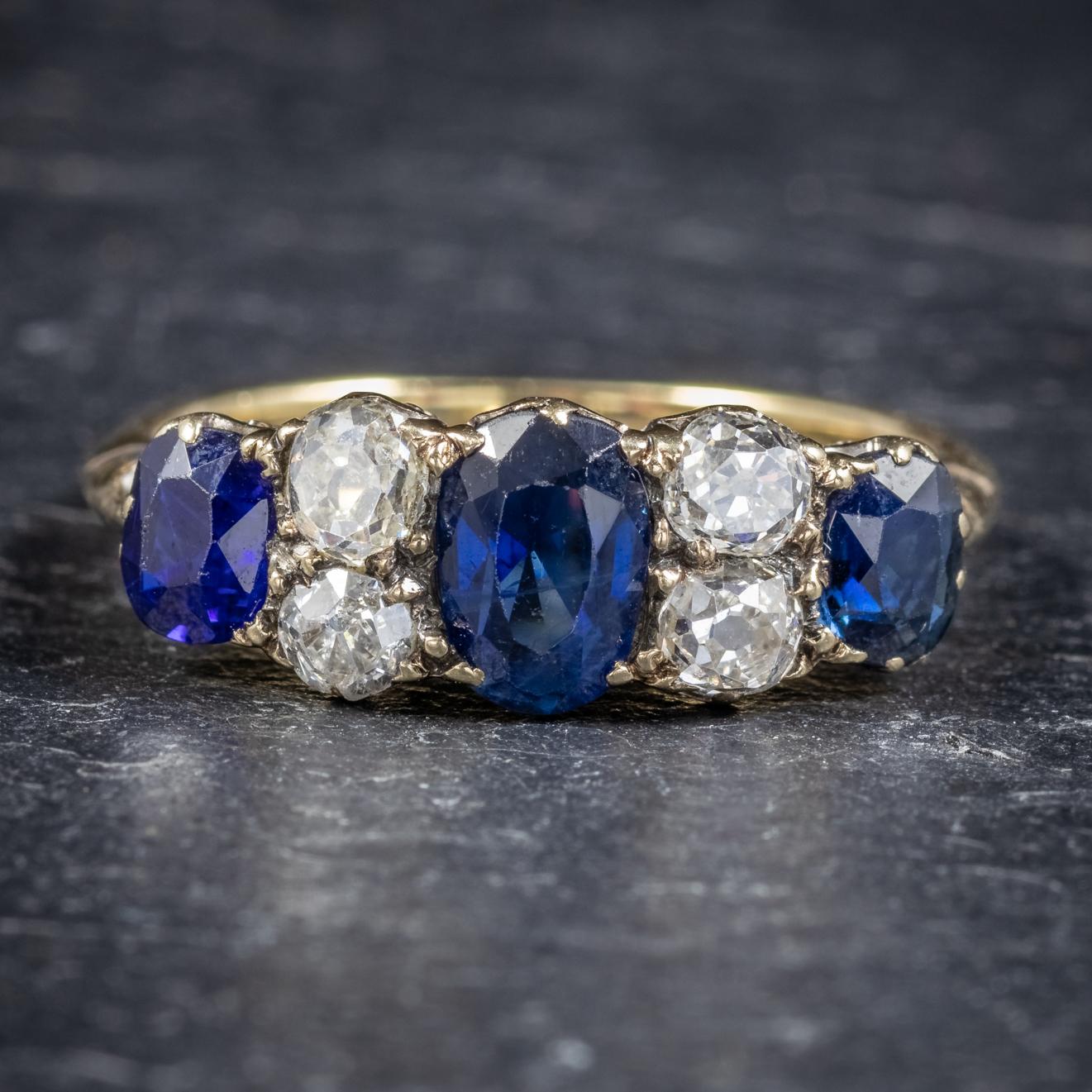 This spectacular antique Victorian five stone Sapphire and Diamond ring is Circa 1900. 

Set with three deep blue Sapphires, the largest of which is approx. 0.70ct with two 0.22ct Sapphires at each end. 

Each old cut Diamond is approx. 0.15ct and