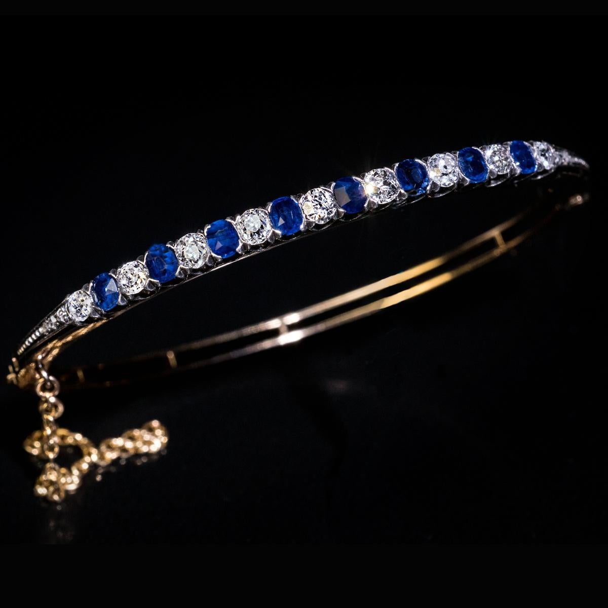 gold bangle with sapphires