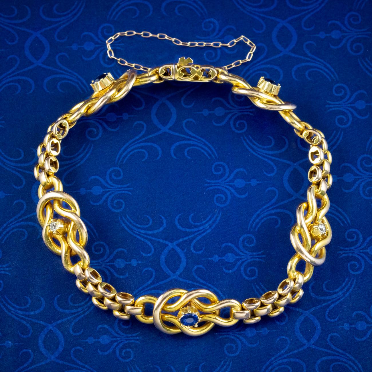 A fabulous antique Victorian love knot bracelet made up of solid 15ct gold brick links and five interwoven love knots each crowned with a blue sapphire or twinkling old mine cut diamond in the centre.

A love knot has long been a symbol of love,