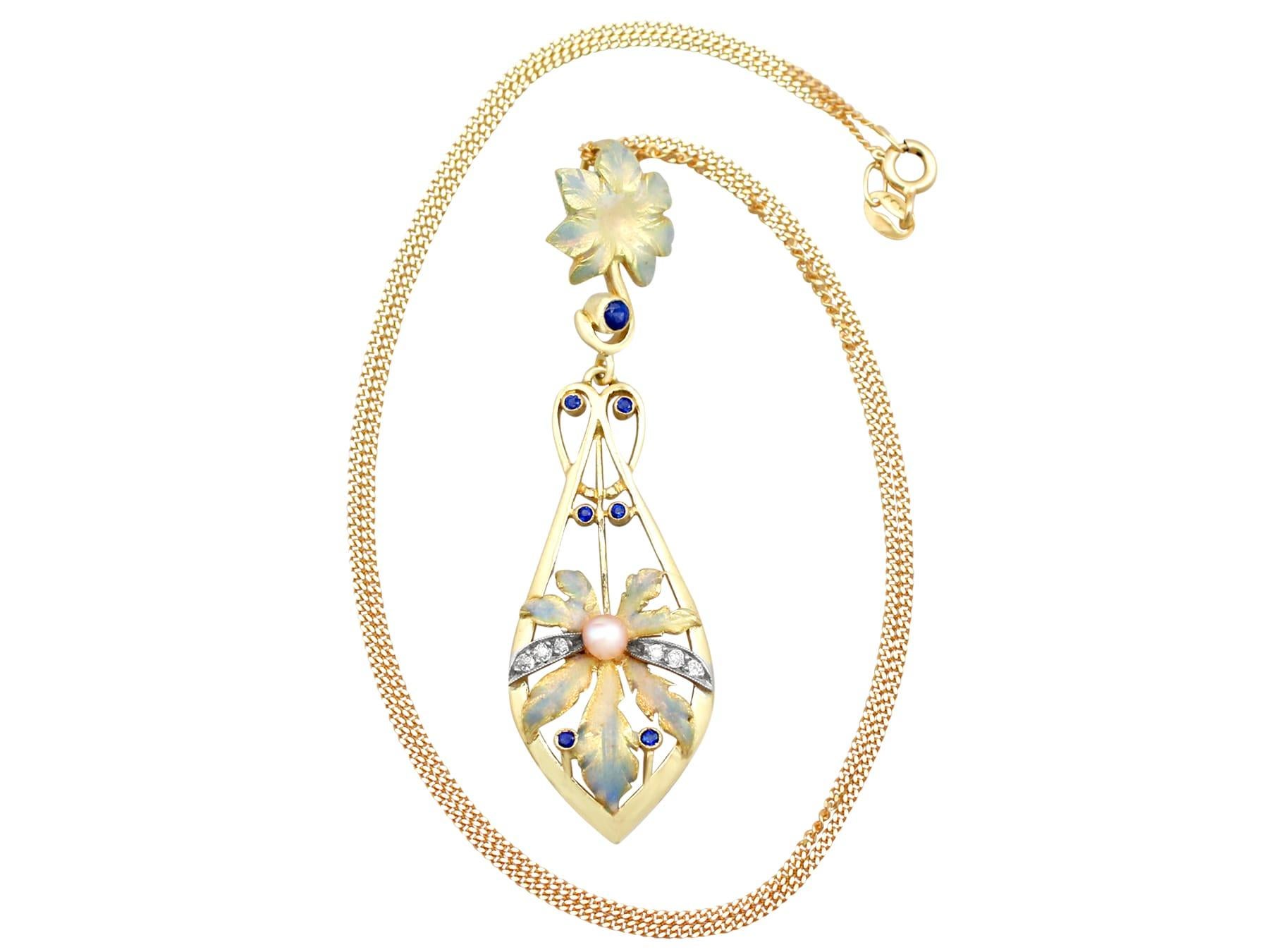 A stunning antique Victorian 0.19 carat sapphire and 0.11 carat diamond, pearl and enamel, 18 karat yellow gold necklace / brooch; part of our diverse antique jewelry and estate jewelry collections.

This stunning, fine and impressive Victorian