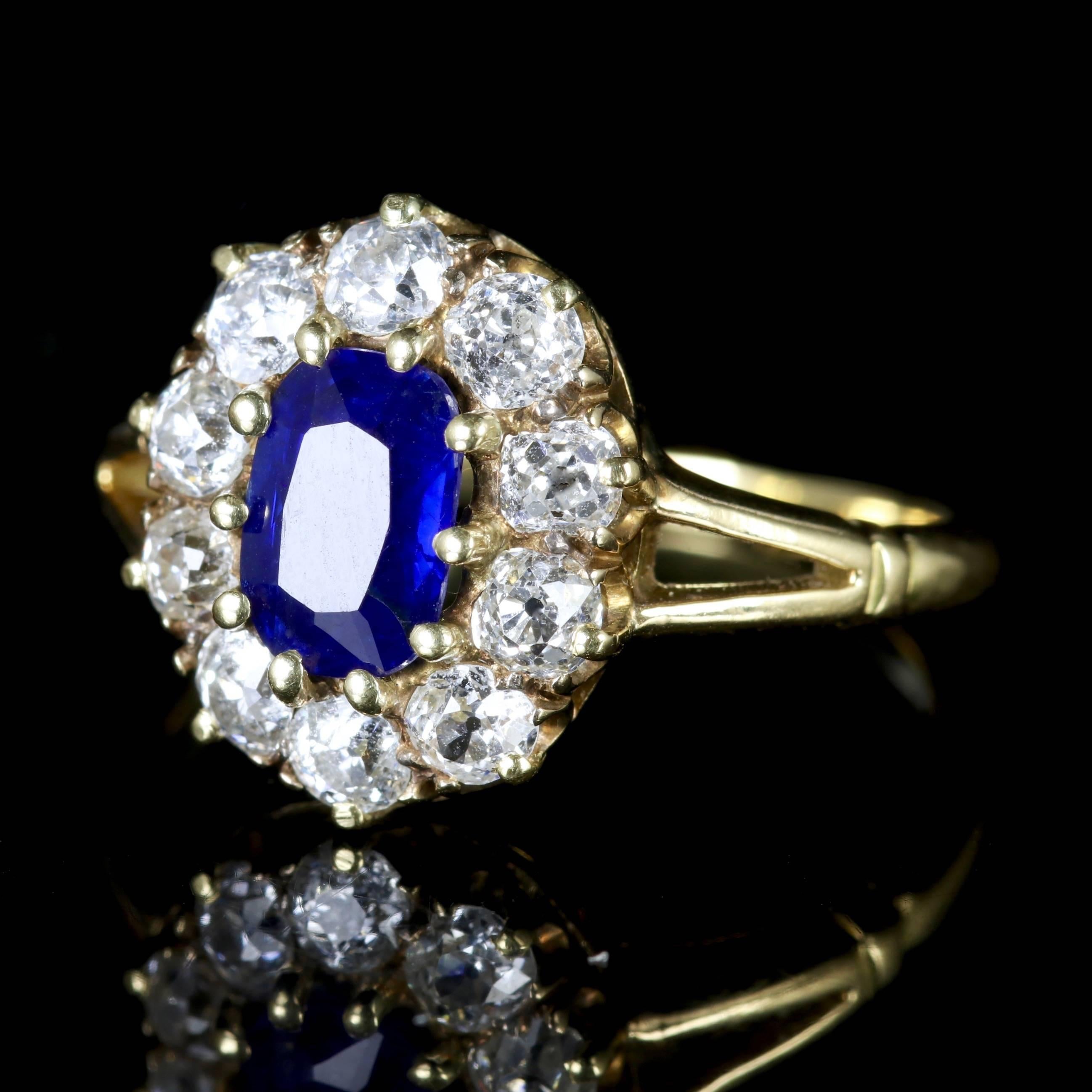 This beautiful Victorian 18ct Gold Sapphire and Diamond cluster ring is Circa 1900.

Set in an elegant, original setting which boasts a 1.45ct deep, blue Sapphire in the centre.

Sapphire is the symbol of feelings of sympathy, harmony friendship and
