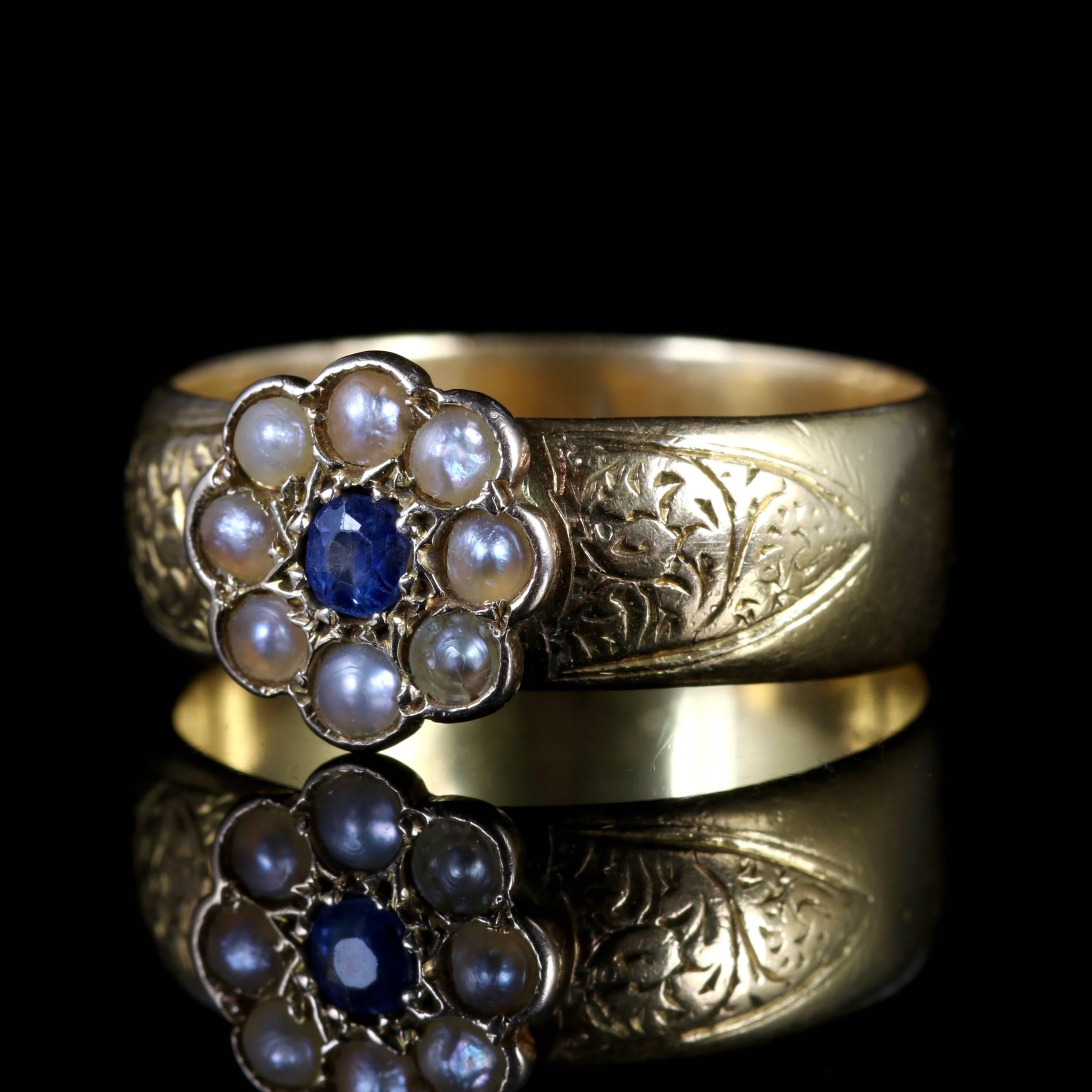 A fabulous Victorian Sapphire and Pearl is set in 18ct Yellow Gold, Circa 1900.

The ring boasts a rich, blue Sapphire which is surrounded by lustrous Pearls which depicts a pretty flower.

The shoulders are both engraved, showing fabulous