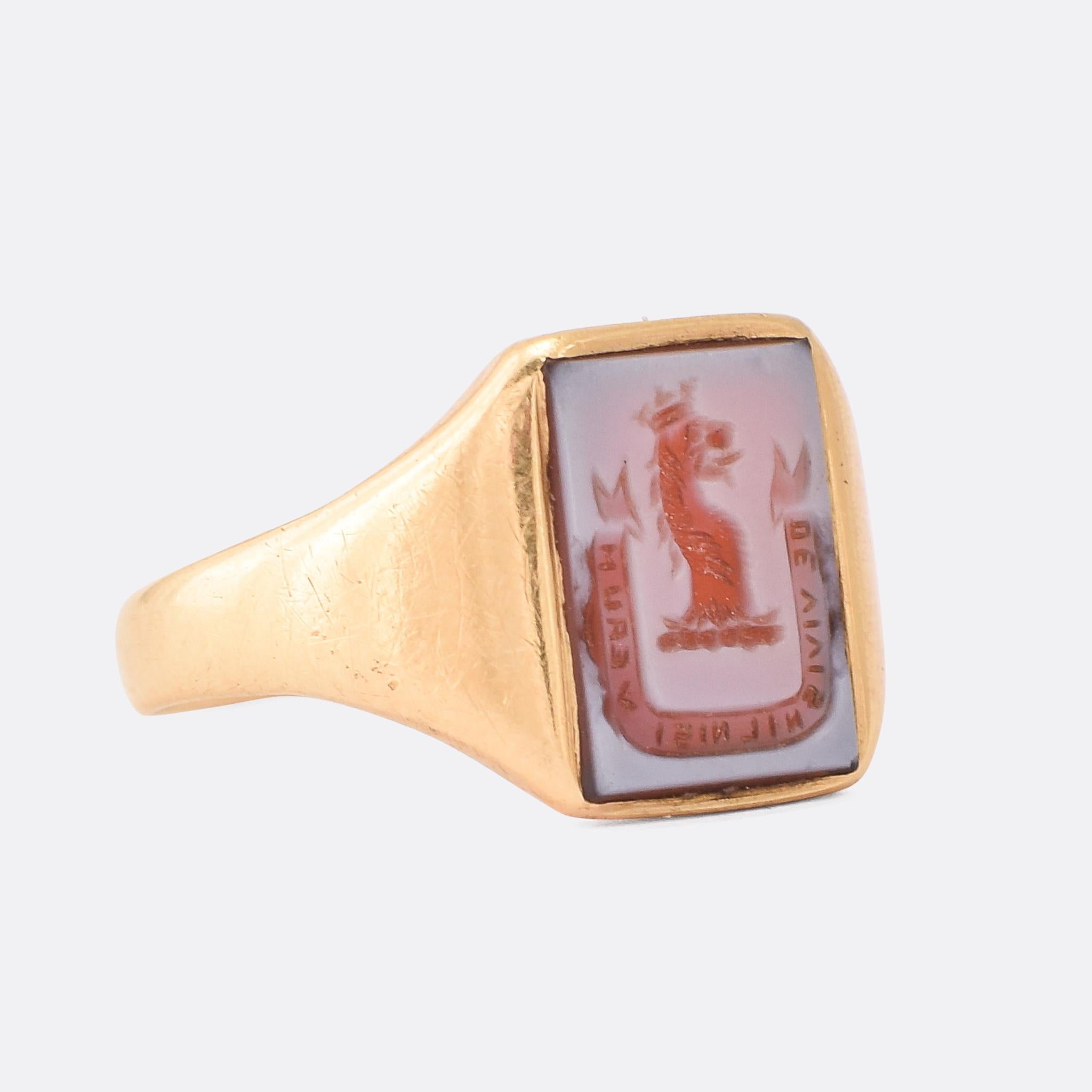 Speak only truth of the living... A cool Victorian signet ring set with an intaglio carved rectangular sardonyx panel. The crest depicts a crowned lion's head, in profile, above the Latin motto: 