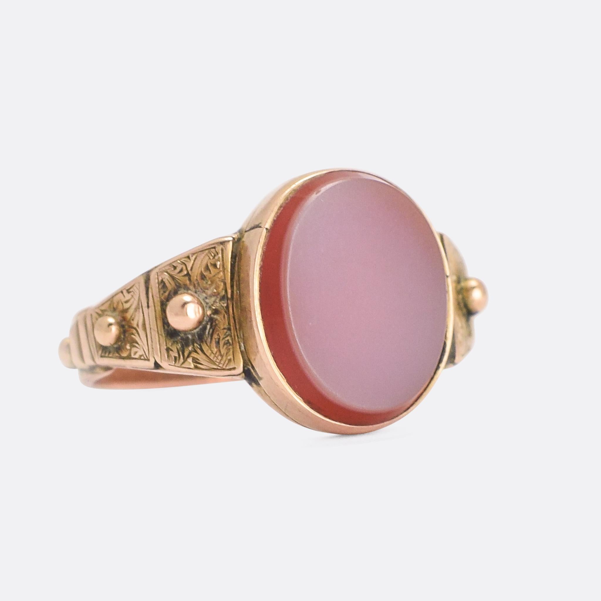 An awesome antique signet / poison ring.... but so much more. The head is hinged, opening up to reveal a secret compartment behind the oval sardonyx panel. It's also a Rosary ring, with studs all around the band designed to be used as a physical