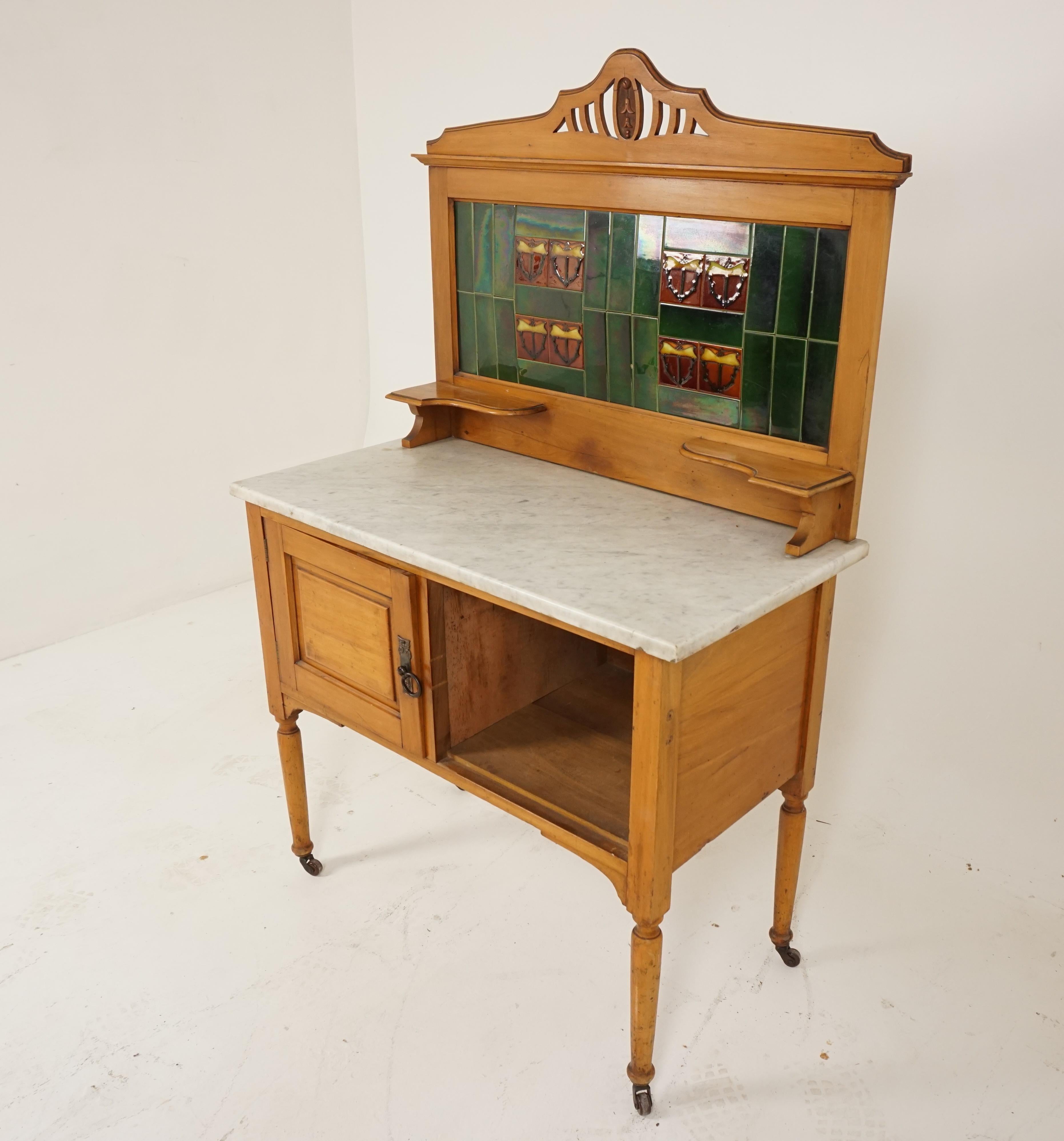 Antique Victorian satin walnut marble top washstand with tiles, Scotland 1900, B2792

Scotland 1900
Solid walnut
Original finish
Carved pediment on top
Colourful tiles to the back splash
Original white marble
Pair of candle shelves
Base