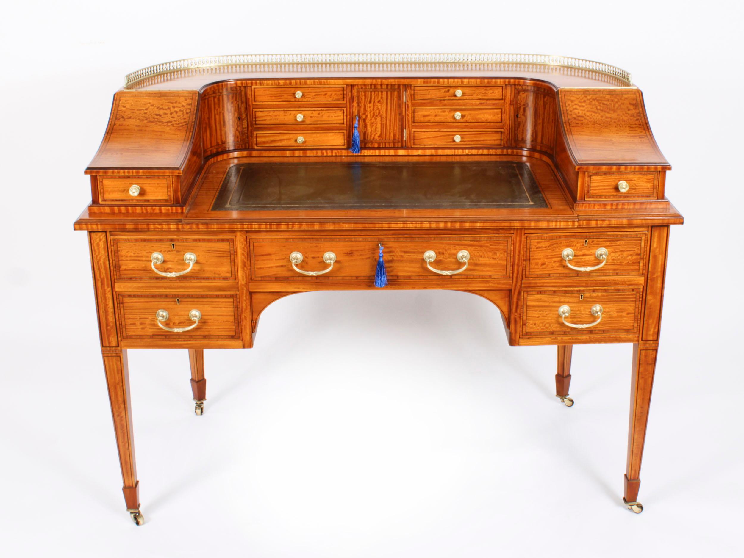 This is a beautiful antique late Victorian satinwood Carlton House Desk,   circa 1880 in date.
This beautiful desk is made from satinwood, which has been crossbanded in tulip wood bordered with boxwood and ebony lines   It is superbly finished all