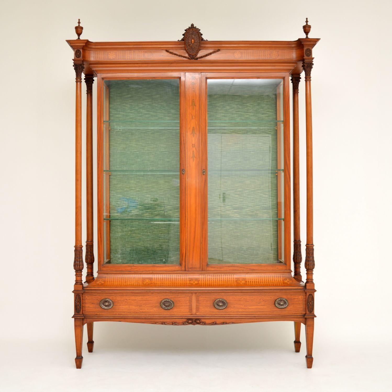 This large antique satinwood display cabinet is the finest quality I have ever come across and is in excellent original condition.

Please enlarge all the images to see all the amazing features, including the very fine carvings on the top central