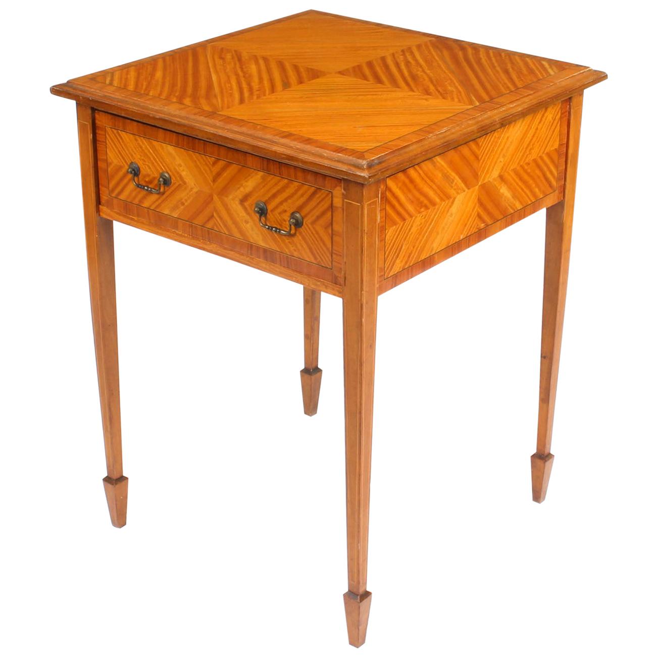 A beautiful antique Victorian satinwood occasional table with an unusually large drawer, circa 1880.

This exquisitely crafted piece is made from satinwood with kingwood crossbanding and boxwood inlay.

Add an elegant touch to your home with