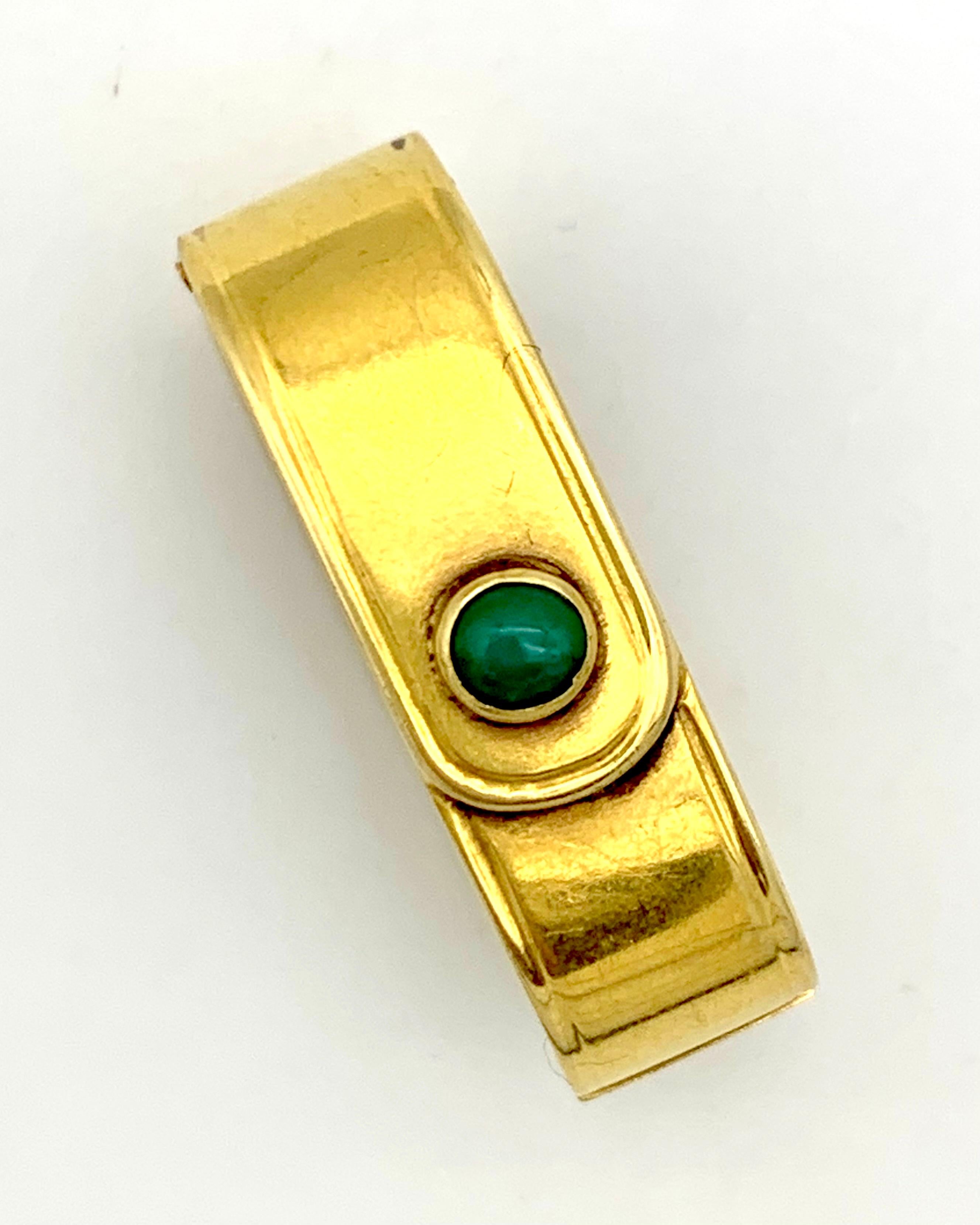  This elegant scarf clip is a fine example of modernistic tendencies in Victorian jewellery design which started to devellop from 1875 ca. This little jewel was created in 1880 ca out of 15 karat gold.  Designed as a tiny belt it has a turquoise
