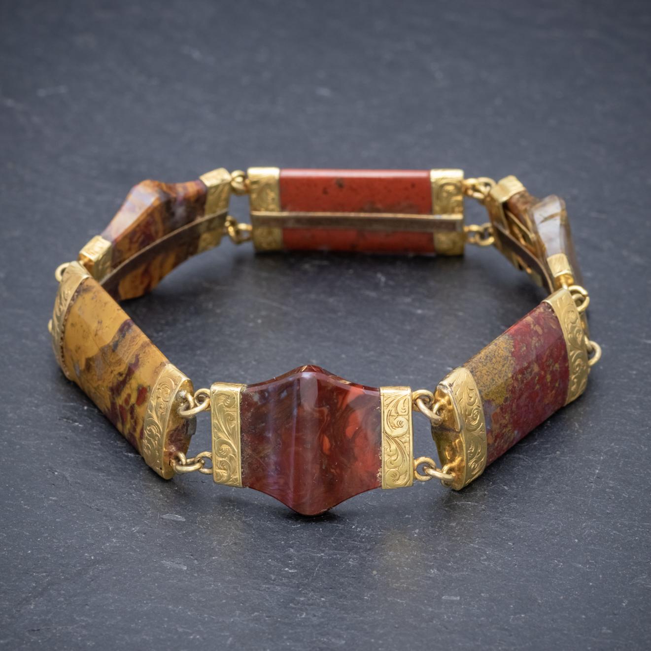 An exquisite antique Victorian Scottish bracelet made up of wonderful Agate links which have been cut into unique shapes. The stones have lovely natural patterns and earthy colouring which are unique to each stone.

Each Agate is tipped with 18ct