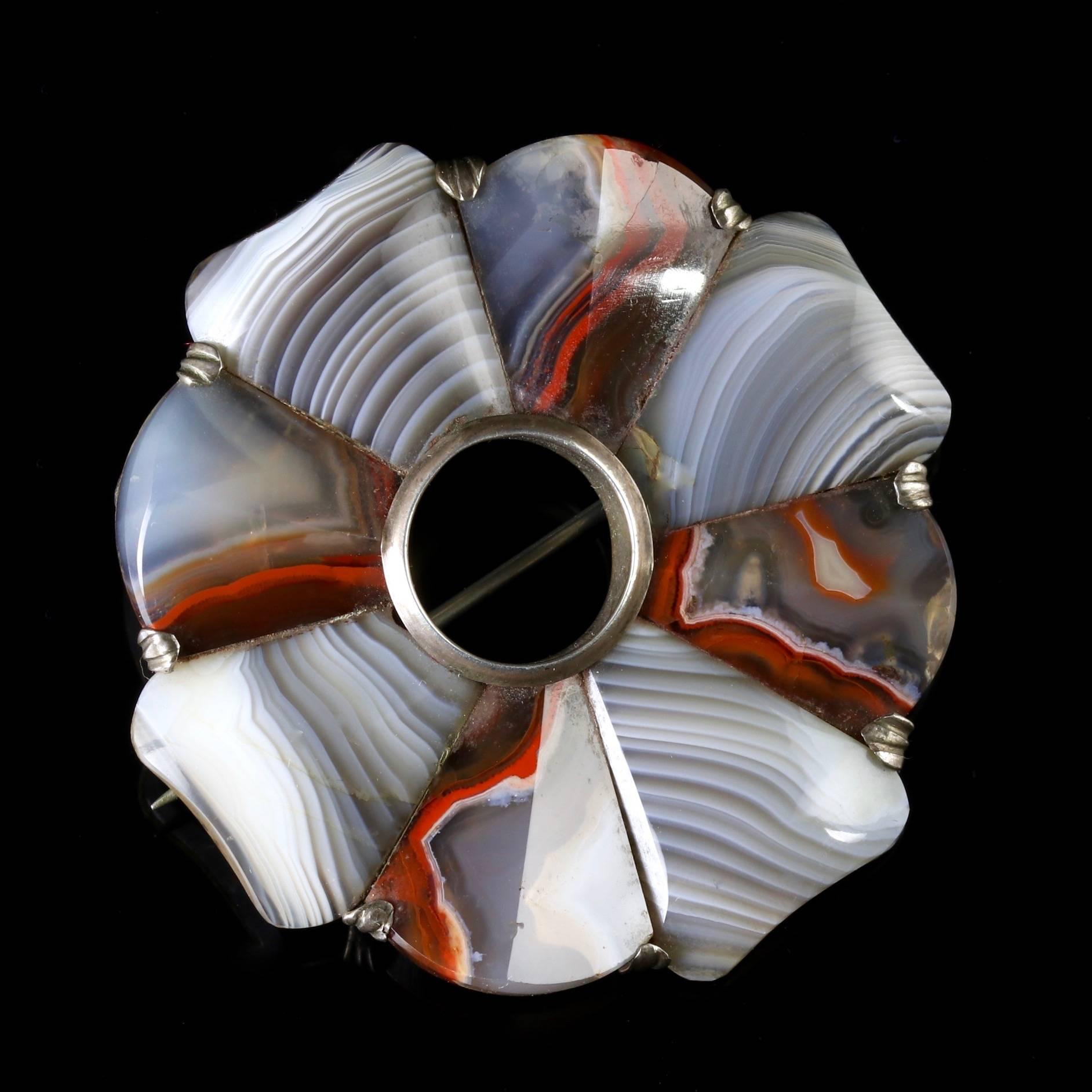 This Victorian Silver brooch is set with fabulous Scottish Agates, Circa 1860.

There are a mixture of different coloured Agates such as browns, light and dark greys and white, which all compliment each-other superbly.

The Agate has a beautiful