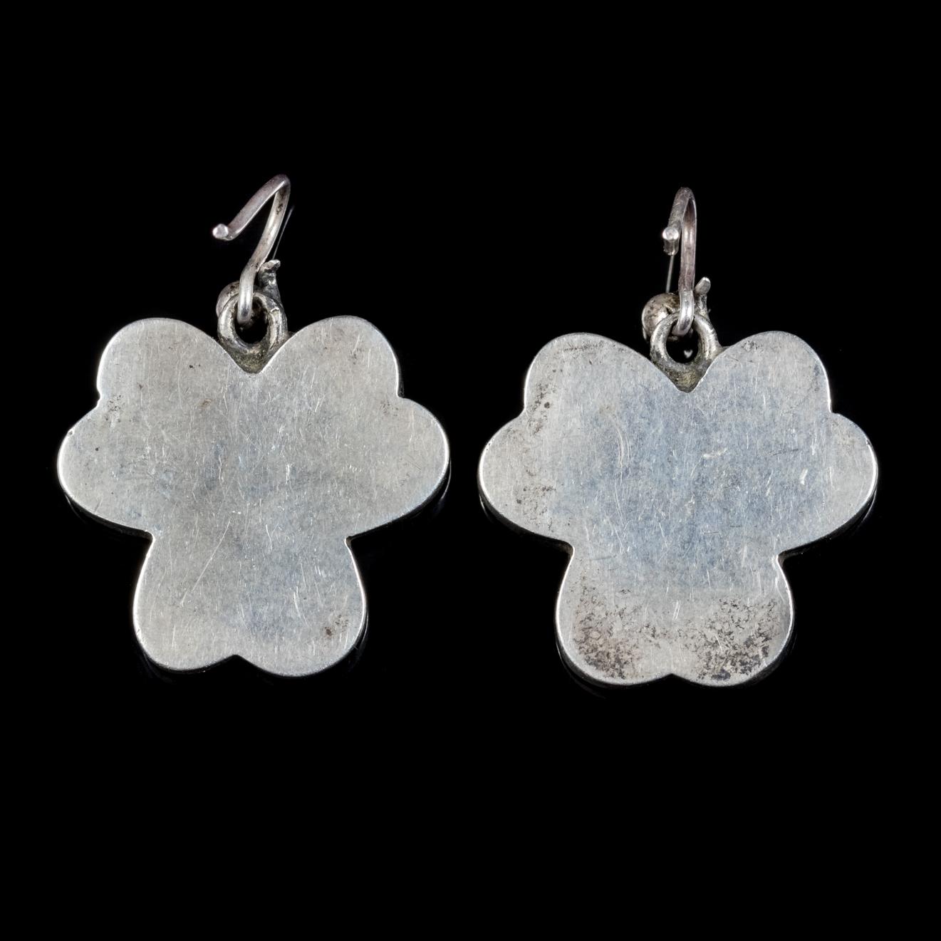 A wonderful pair of antique Scottish shamrock earrings from the Victorian era, Circa 1880.

The lovely pair are fashioned in the shape of shamrocks and feature lovely Scottish Granite stones cut to fit each of the three leaves.

Shamrocks were a