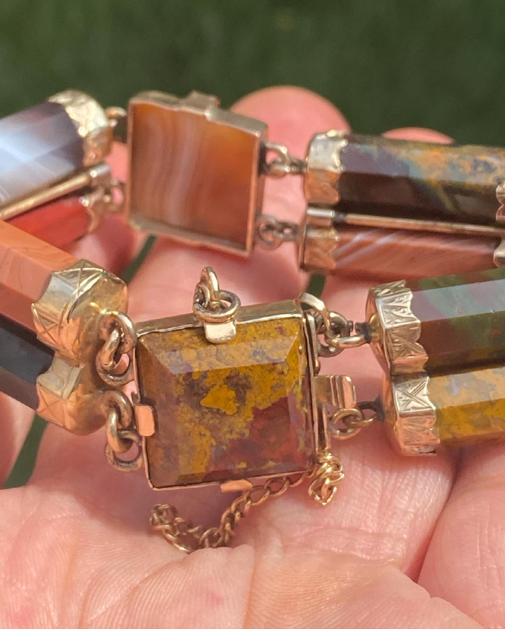 This is a beautiful antique Victorian Scottish agate bracelet in yellow gold circa 1880-1900.  The bracelet is connected by 4 pairs of faceted cylindrical agates 3 square shape agates of various colors and patterns. The terminals and frames are