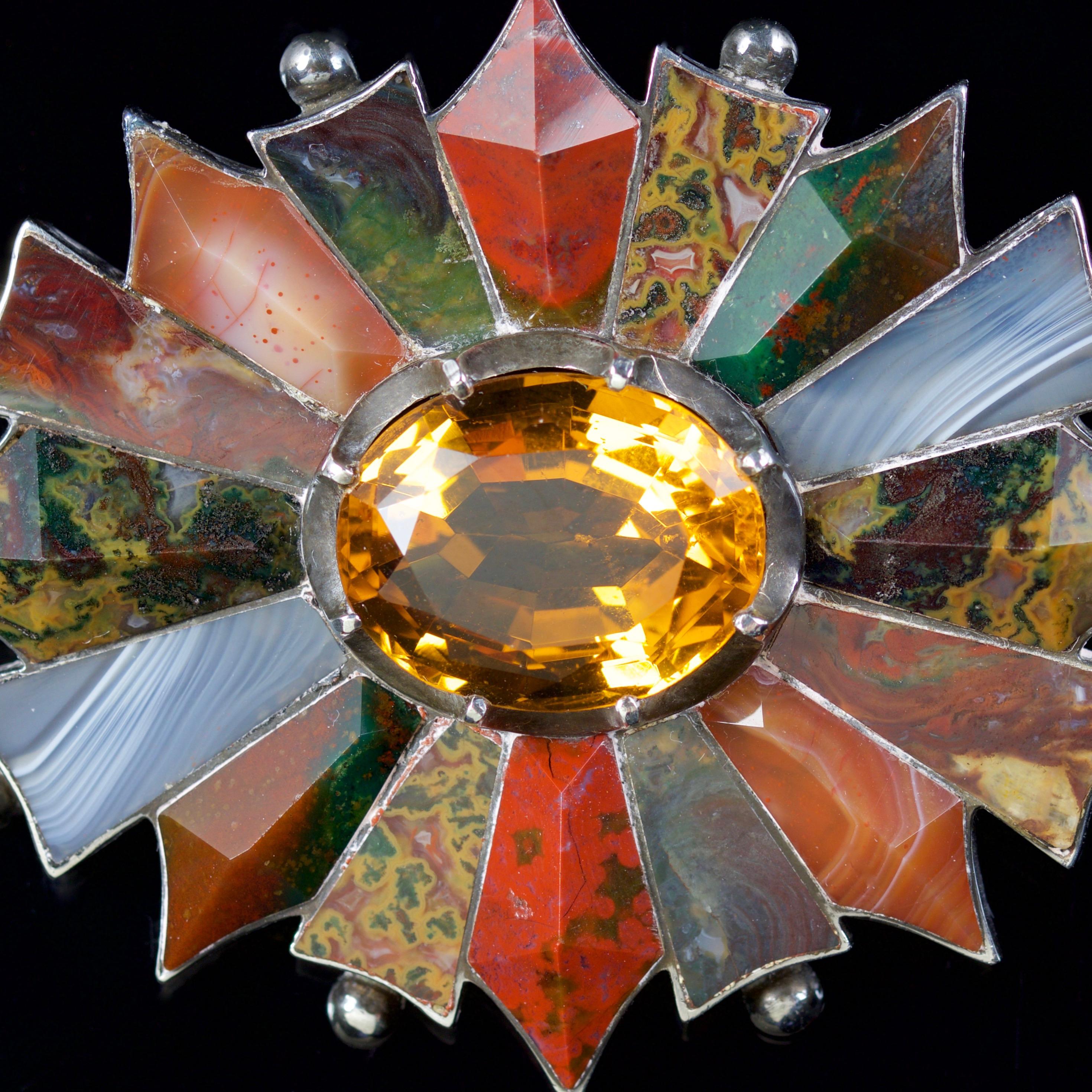 This fabulous Scottish Plaid Agate brooch is set in Sterling Silver, Circa 1860.

Scottish Jewellery was made popular by Queen Victoria as it became a souvenir of her trips to Scotland. 

The beautiful brooch is set with a 10ct Citrine in the