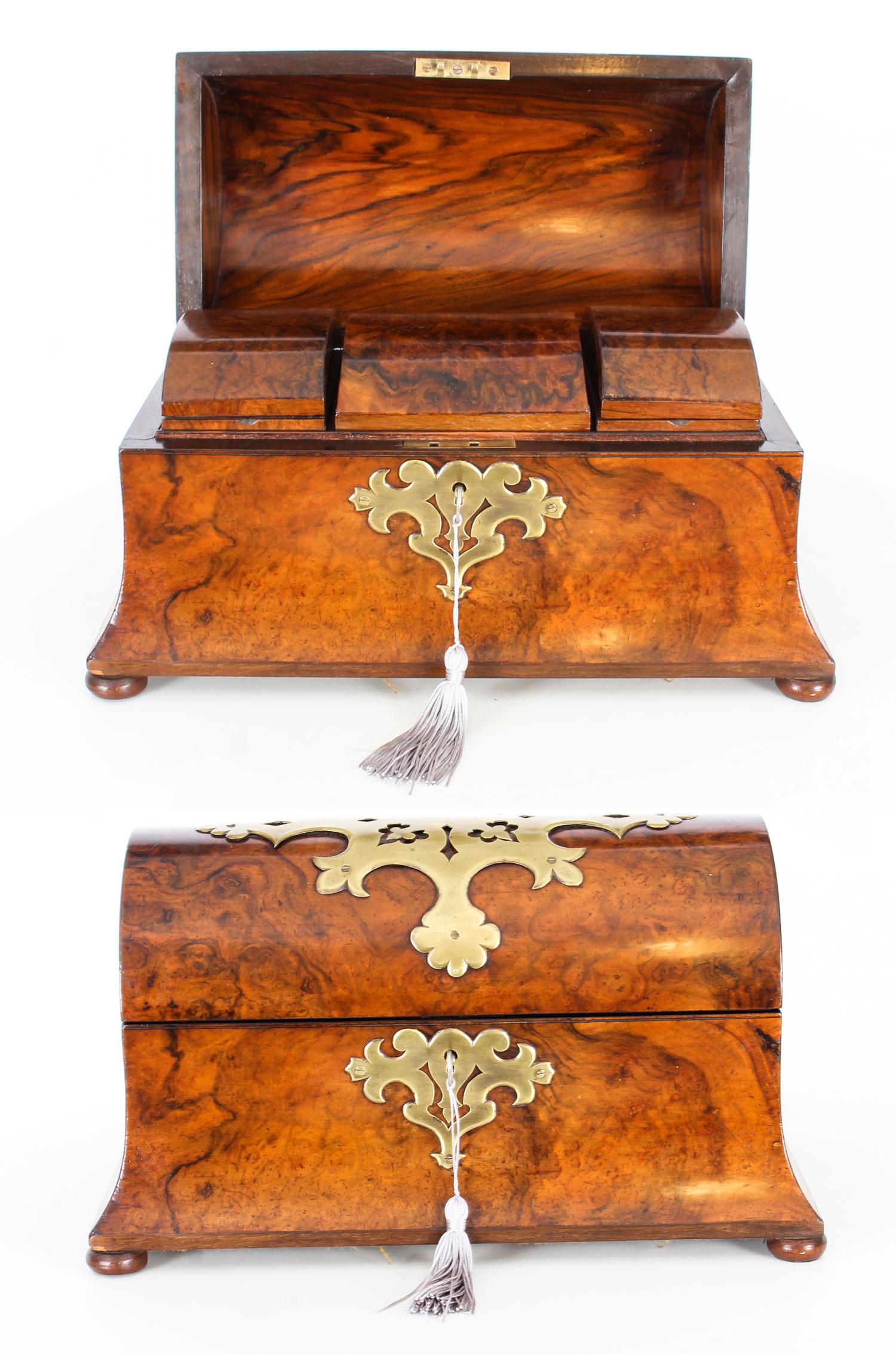 This is an exquisite antique Scottish Victorian domed top tea caddy, circa 1860 in date.

It is beautifully decorated with cut brass decoration to the burr walnut.
 
The box has a hinged top which opens to reveal three beautiful lidded