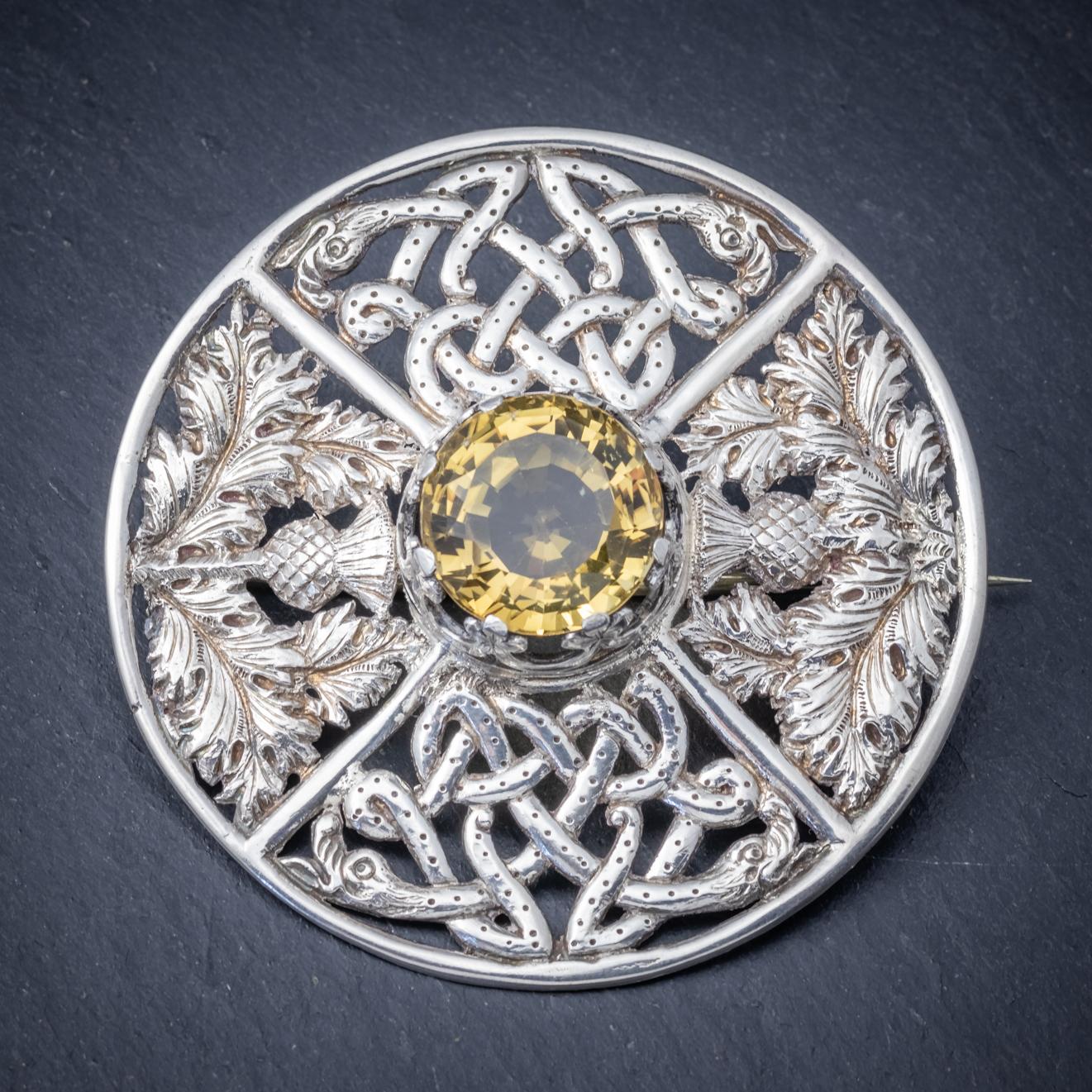This spectacular antique Victorian Scottish brooch is fully hallmarked and dated Glasgow 1901. 

The piece boasts a magnificent golden Cairngorm in the centre which is approx. 40ct and set in a crown-shaped mount. 

The brooch is modelled in