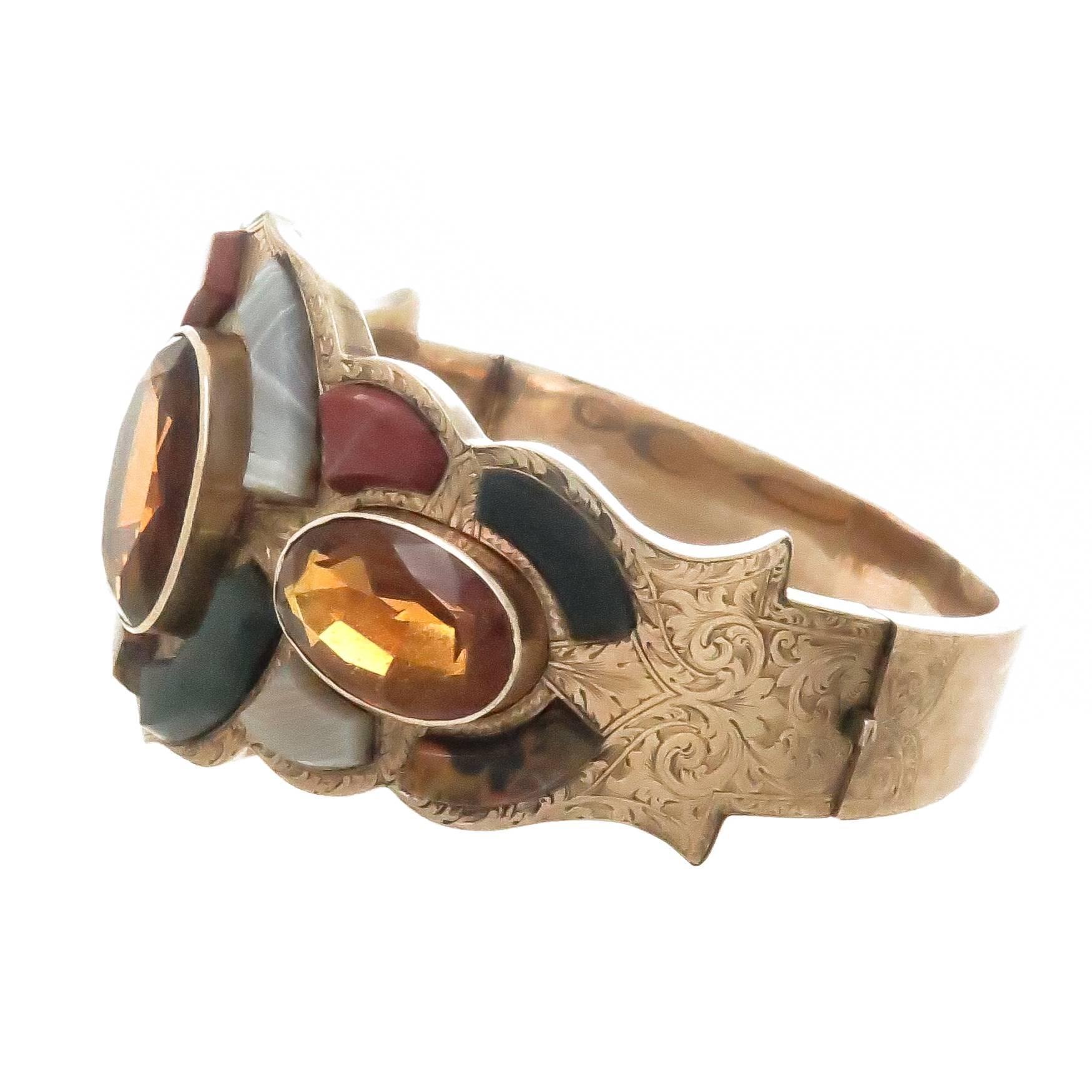 Circa 1890s Scottish 14K Rose Gold Bangle Bracelet, set with different colors of Scottish Agate stones and 3 fine color Oval Citrines. The Bracelet measures 1 1/2 inches wide at the very top with an inside wrist measurement of 6 1/2 inches.