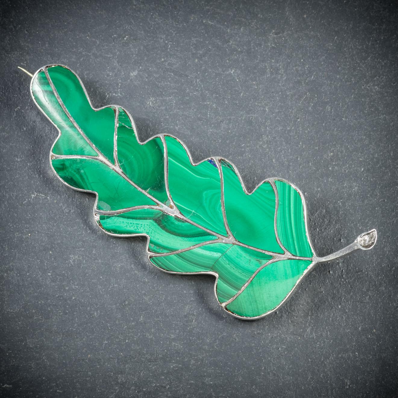 A striking antique Scottish leaf brooch from the Victorian era, Circa 1900

The wonderful leaf shaped brooch is set with beautiful green Malachites which have lovely natural patterns across the surface

All set in Silver and fitted with a secure pin