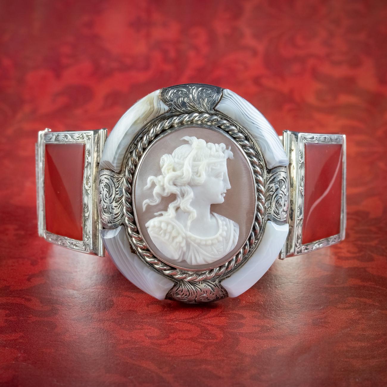 A remarkable antique Scottish bracelet from the mid-Victorian era featuring an exquisite hand-carved bullmouth shell cameo in the centre, depicting the side profile of a character from Roman mythology, possibly the God Apollo who is intricately