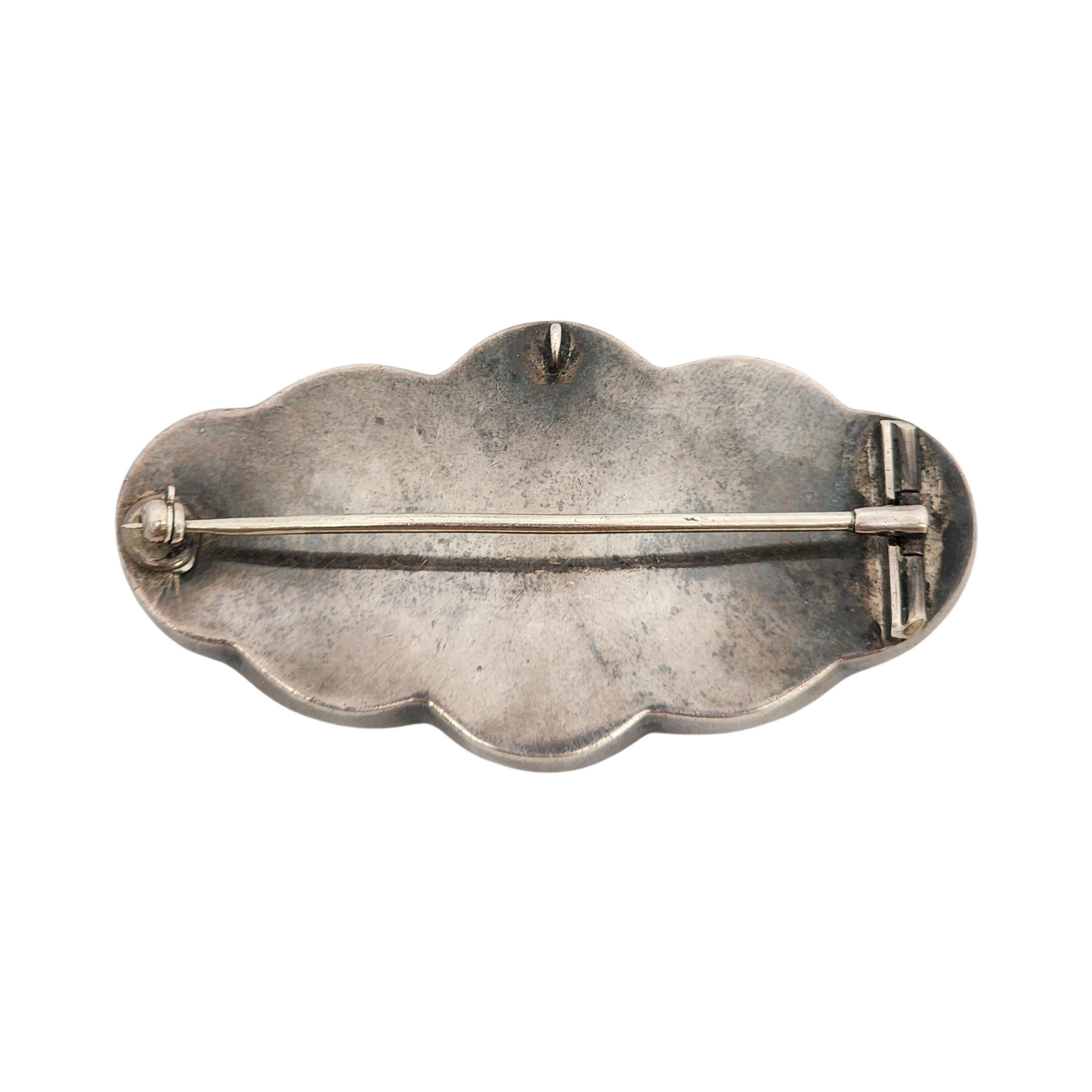 Antique Victorian Scottish agate silver pin/brooch/pendant.

Beautiful design featuring different colored agates with beautiful striations inlaid in silver with scalloped edges. These pieces were poplar in the mid-to late 1800s. Each piece is