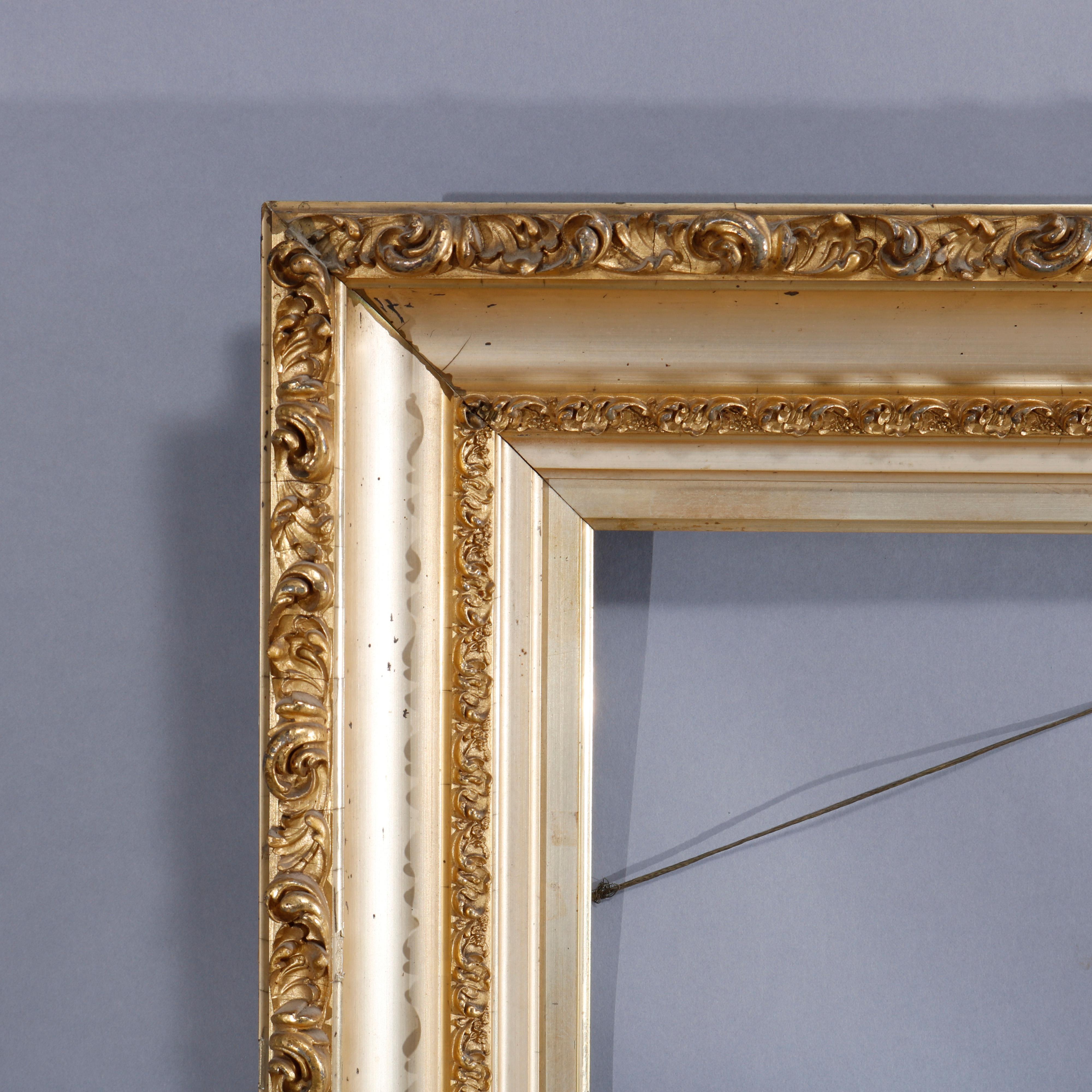 An antique Victorian painting or picture art frame offers giltwood construction with scroll and foliate form banding, circa 1890

Measures: 31.5