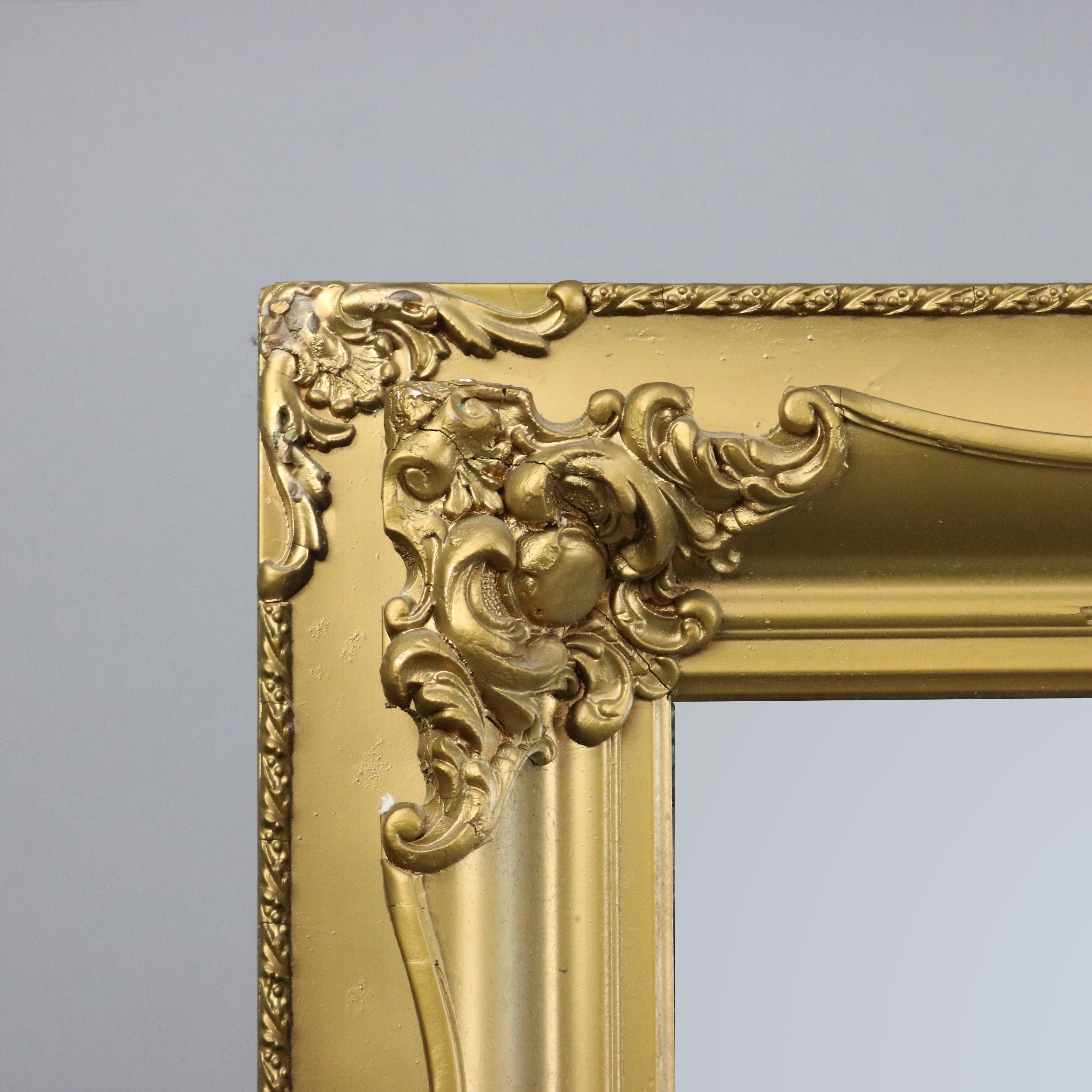 An antique Victorian wall mirror offers sculpted form with scroll and foliate elements, circa 1890.

Measures - 22.75