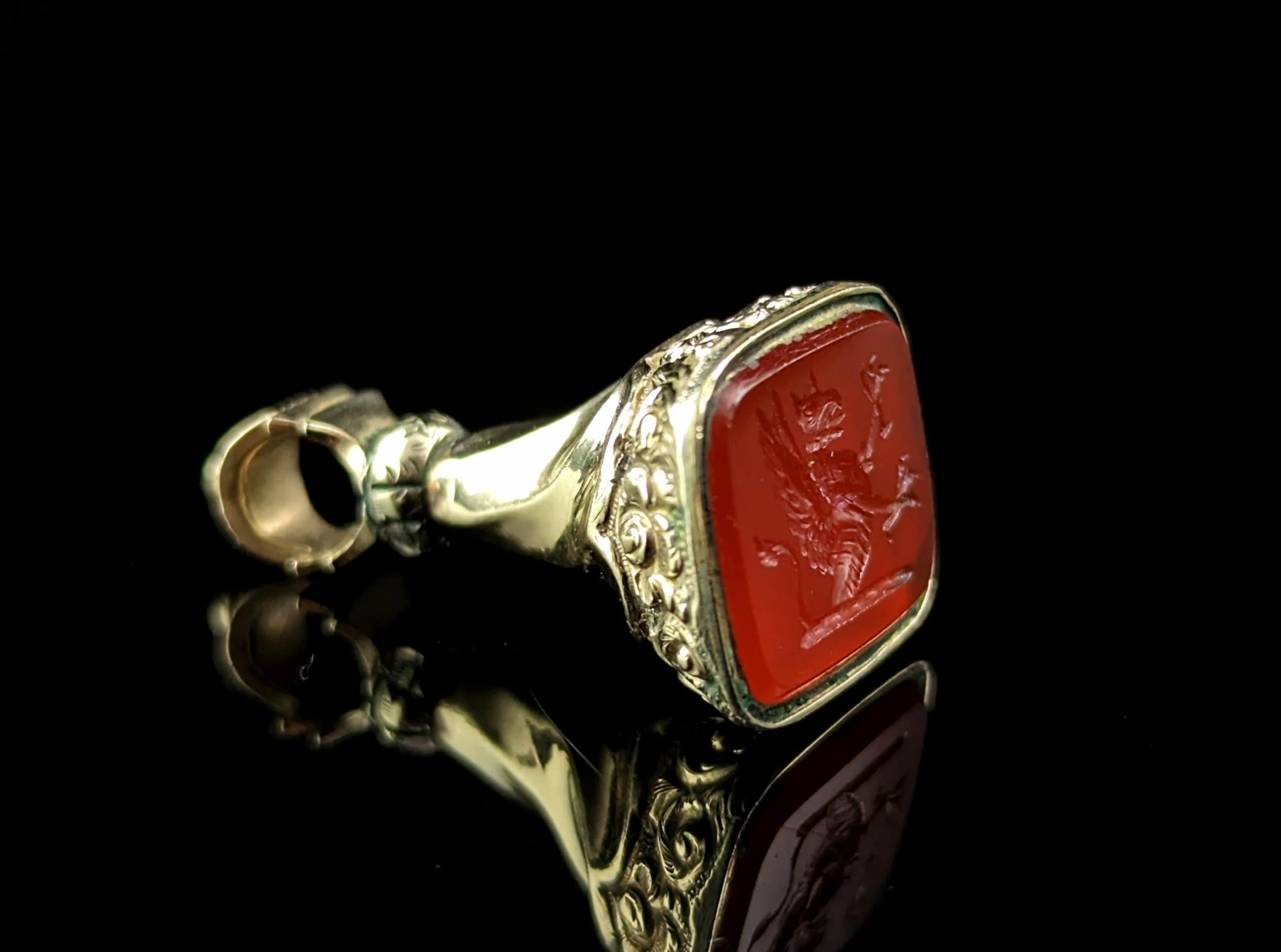 There is something quite special about antique seal fobs, not only are they beautiful but they are also functional.

This fine Victorian intaglio seal fob is crafted in 9ct gold with an interesting liquid swirl design and it has traditional chased