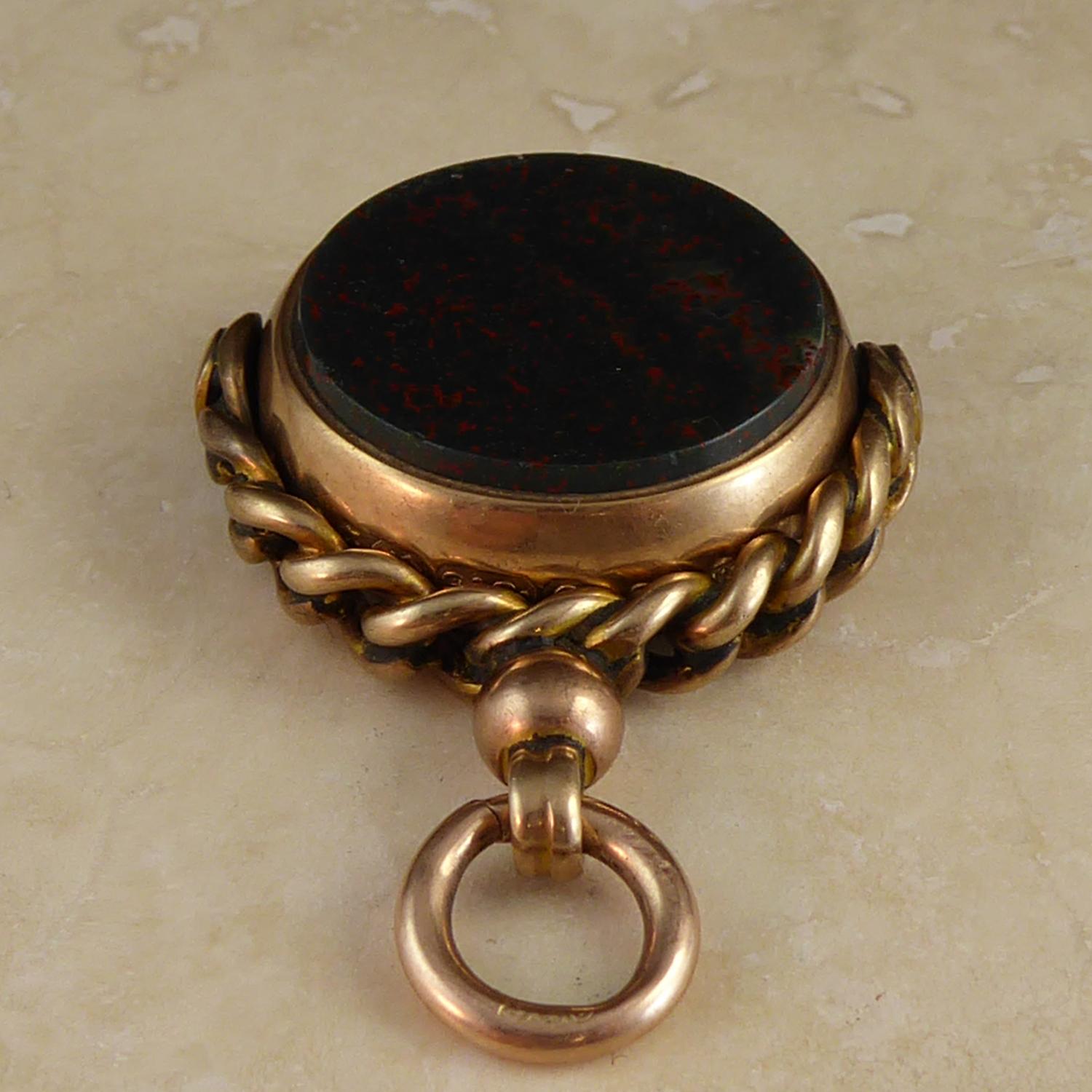Originally seen on a pocket watch chain and often carved with a crest, spinner fobs such as this one also make an interesting pendant in a way that brings the antique into the present.  This one is in 9ct rose gold and bears the hallmark from the