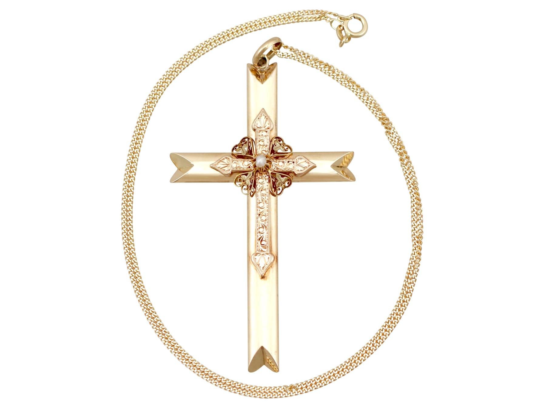 hands holding cross necklace
