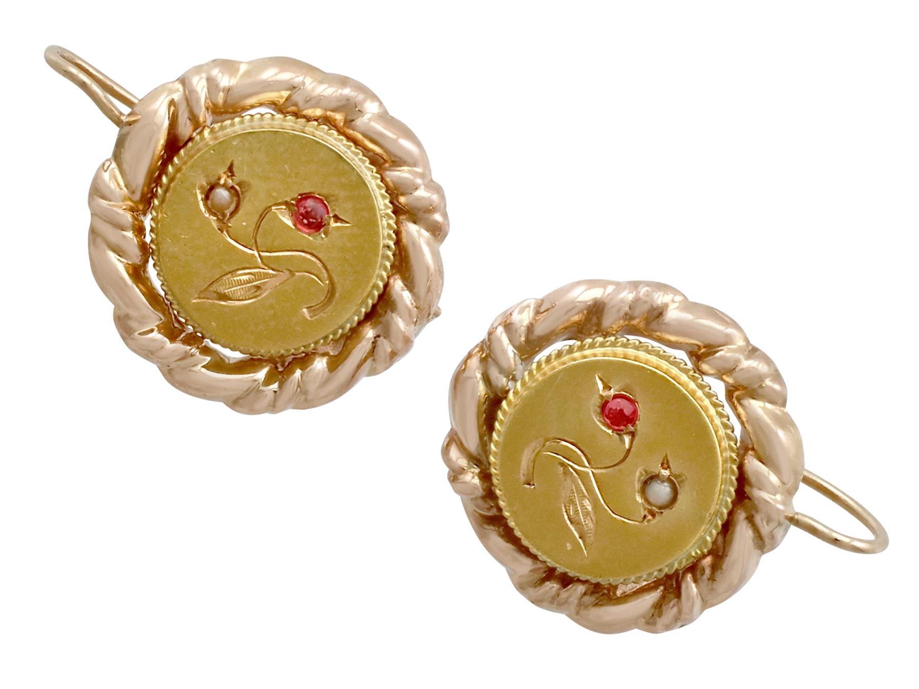 An impressive pair of vintage seed pearl and imitation gemstone, 18 karat yellow gold drop earrings; part of our diverse antique jewelry and estate jewelry collections.

This fine and impressive pair of Victorian gold earrings have been crafted in