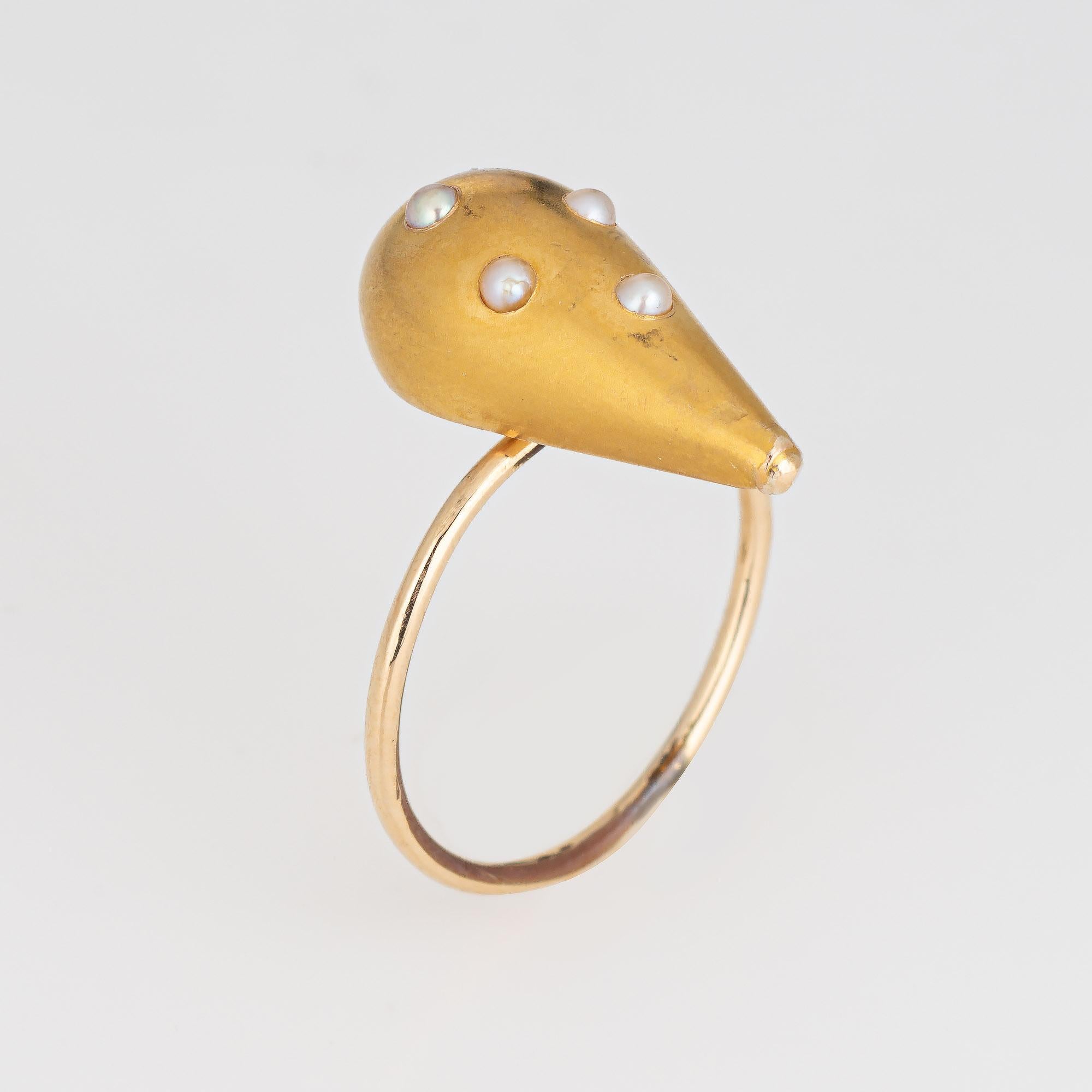 Originally an antique Victorian era stick pin (circa 1880s to 1900s), the seed pearl ring is crafted in 14 karat yellow gold.

The ring is mounted with the original stick pin. Our jeweler rounded the stick pin into a slim band for the finger. The