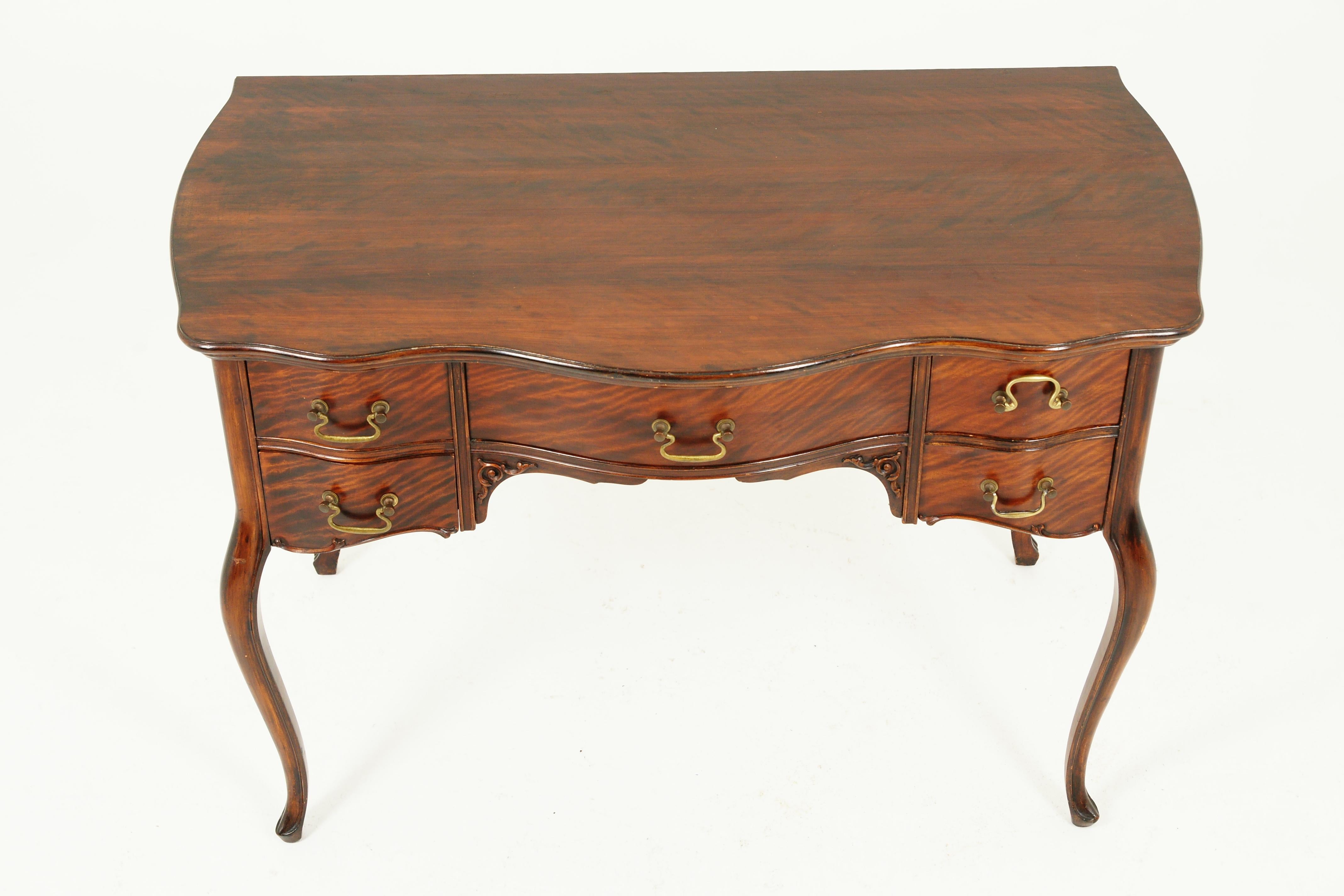 Antique Victorian Serpentine front writing table, Vanity, American 1900, B2534

American 1900
Solid walnut
Original finish
Serpentine top
Single bow front drawer
Flanked by a pair of small drawers on each side
Original brass pulls
All