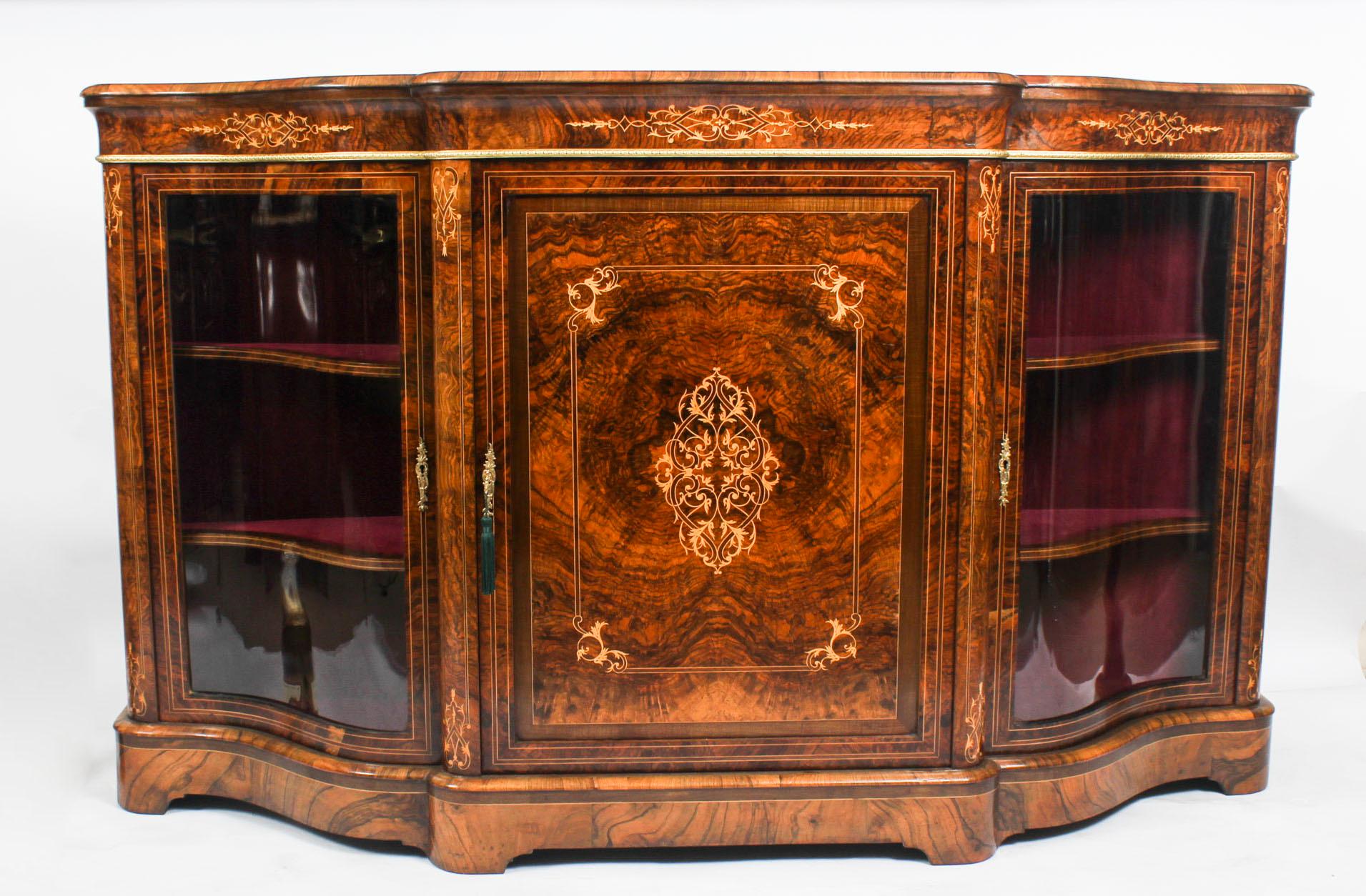 Antique Victorian serpentine inlaid burr walnut credenza side cabinet 19th century.
This is a superb antique Victorian burr walnut inlaid credenza, circa 1860 in date. This piece highlights the unique and truly exceptional pattern of the burr